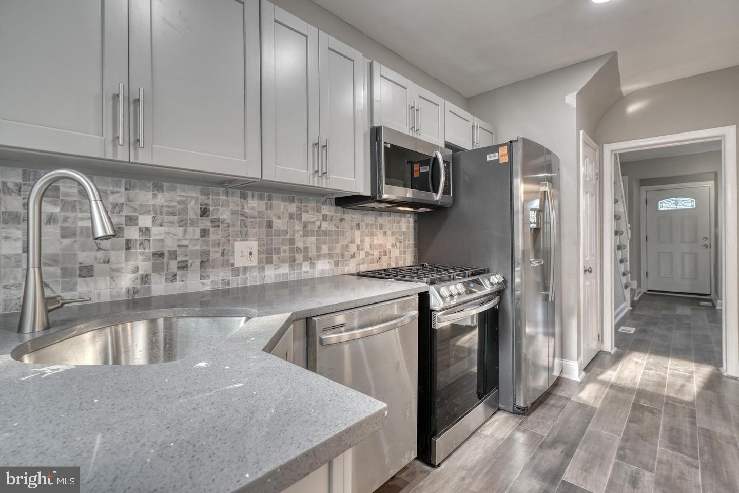 Fully Renovated 4-Bedroom Townhouse with Garage – Ideal for Homeowners or Investors!
This stunning, fully remodeled 4-bedroom, 2-bath townhouse offers modern comfort and convenience in an unbeatable location near Morgan State, Johns Hopkins, Loyola University, and Lake Montebello. Featuring a sleek kitchen with quartz countertops, stainless steel appliances, and classic wood shaker cabinets, this home blends style with functionality. Beautiful hardwood floors, plush wall-to-wall carpeting, and replacement windows enhance the home's charm and efficiency.
The upper-level bathroom includes a built-in Bluetooth speaker/light for a spa-like experience. The finished basement suite is perfect for guests or renters, complete with a spacious family room, bedroom, and full bath. A private garage adds rare value and convenience.
Situated in a vibrant, up-and-coming neighborhood near Good Samaritan Hospital, Mount Pleasant and Clifton Park Golf Courses, this property is perfect for anyone seeking a modern home or an investor aiming to rent to college students. Don’t miss this exceptional opportunity!