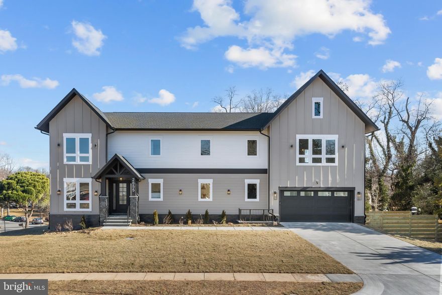 Welcome to another magnificent project by Gilkar Design + Build. *** 6 bedrooms, 6 full baths and 2 half baths, 6,600+ sqft. The main level has a cozy and welcoming foyer, 10' ceilings, 8' solid wood doors and cased openings, and engineered hardwoods throughout. Open concept kitchen/living, living/dining and large library/office/formal sitting with french doors. A stunning kitchen design with a ZLINE Autograph  Edition black stainless steel with polished gold accent appliance package, ample cabinetry to the ceiling, floating shelves, a separate large and well-lit pantry, and a large kitchen island with seating. A large gas fireplace with a stone surround and tons of windows rounds out the living room. The dining space has a ceiling feature and wainscoting throughout the main level. The deck has built-in gas and hot/cold water lines, an oversized 2-car garage with a high-lift garage door, and 1 EV car charger. A functional mudroom *** The upper level has the primary bedroom, which boasts a tray ceiling, a giant ceiling fan, and a walk-in closet. A jaw-dropping primary bath with rain shower heads, a free-standing tub with a faucet, and a double vanity with ample cabinets. An additional three bedrooms with walk-in closets and full private bathrooms are down the hall. Second-floor laundry room has a high-capacity washer and dryer (stacked) with removable built-ins, a sink, and extra cabinetry space (1 of 2). Engineered hardwood floors are on the second floor. *** The lower level is fully finished witha rear walk-up, a kitchenette, a full-size stainless steel refrigerator, and a dishwasher. A large recreation/media room with 2 additional bedrooms, 2 full baths, and 1 half bath. LVP floors throughout the lower level. Basement laundry has a high-capacity washer and dryer with a sink (2 of 2). *** Additional features include 2” thick stair treads, millwork throughout, plumbing manifold system, hot water recirculation system, and above-code insulation. Solid wood doors, ceiling fans, LED lights, LED stripe tape lights, and Smart features throughout. Verizon Fios is run to the house, and the router is located in the mechanical room. Extra WiFi extender points on the upper and main levels. Ring video doorbell and 3 Ring security cameras convey with the house. Close to Tysons, Vienna, and Falls Church, with a great selection of restaurants and shopping to suit everyone's needs. Easy access to 495 and 66.