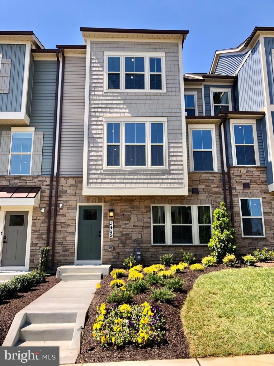 MOVE IN READY! END UNIT Serenade with a backyard at The Villages of Urbana by Ryan Homes. The Serenade plan offers an updated take on outdoor living, with a covered deck included off the main level. Inside, the kitchen has a large island, plenty of cabinets and a pantry for storage. Upstairs are 3 large bedrooms, including the primary suite with walk-in closet and bath with dual vanities and large shower with a seat. Includes a 4th bedroom and full bath on lower level. This award-winning, masterfully planned community features:  - 2 community centers - 3 pools (lazy river, fountain and slides) - Tennis courts - Walking and biking trails - Urbana school district -Community garden and farmer's market  - And more!    Photos are representative.