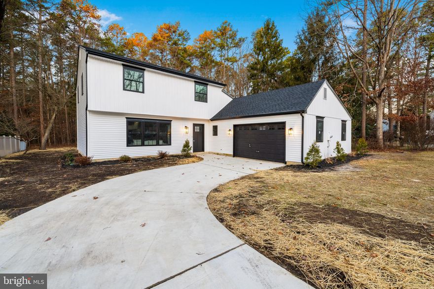 Welcome to 15 Fletcher Blvd, Sicklerville, NJ! This fully renovated home, featuring all-new siding and a brand-new roof, is designed to impress with a modern open-concept layout that seamlessly blends style and functionality. Upon entry, you're greeted by all-new flooring and a bright, inviting space that includes a sitting area, dining room, and a beautifully updated kitchen. The kitchen boasts sleek white tile backsplash, granite countertops, and brand-new stainless steel appliances. A spacious living area sits on the other side of the entryway, providing plenty of room for relaxation and gatherings. The main floor also features a convenient half bath and a laundry room. Upstairs, you'll find three generously sized bedrooms with brand-new carpeting and an updated full bathroom. The master bedroom includes its own full bathroom. Step outside to a huge backyard, perfect for entertaining, outdoor fun, and family activities. This home is truly move-in ready—schedule your showing today and make it yours!