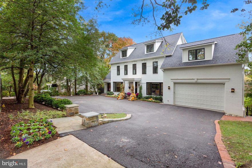 Everything about this Spring Valley home is spectacular! Experience brilliant views from all four levels of this home overlooking the valley. This 6 bedroom, 5.5 bathroom home is filled with bright light in every room. It was masterfully renovated and expanded just a few years ago by local builder, Lot Squared Development. The current owner invested nearly a million dollars following purchase to enhance the interior and exterior. The improvements include a year-long professional landscaping project to create a glorious and useful tiered rear yard paradise, with two turf lawns, a bocce court, and a play house.  A newly installed "Control4" audio/video/security system makes entertainment and security a breeze with control panels in many rooms throughout the house. Motorized window treatments, shutters, custom drapery and carpets, were carefully selected by a local designer.  A detailed list of improvements/pricing will be shared at request.  Wolf, Bosch, and Sub-Zero appliances, with elegant quartz countertops come together to create a stunning eat-in kitchen. "Waterworks" fixtures are in each bathroom. Enjoy three outdoor decks, including a private deck just off the primary bedroom. The home offers two secure garage parking spaces, and three additional  surface parking spaces in the front of the home.