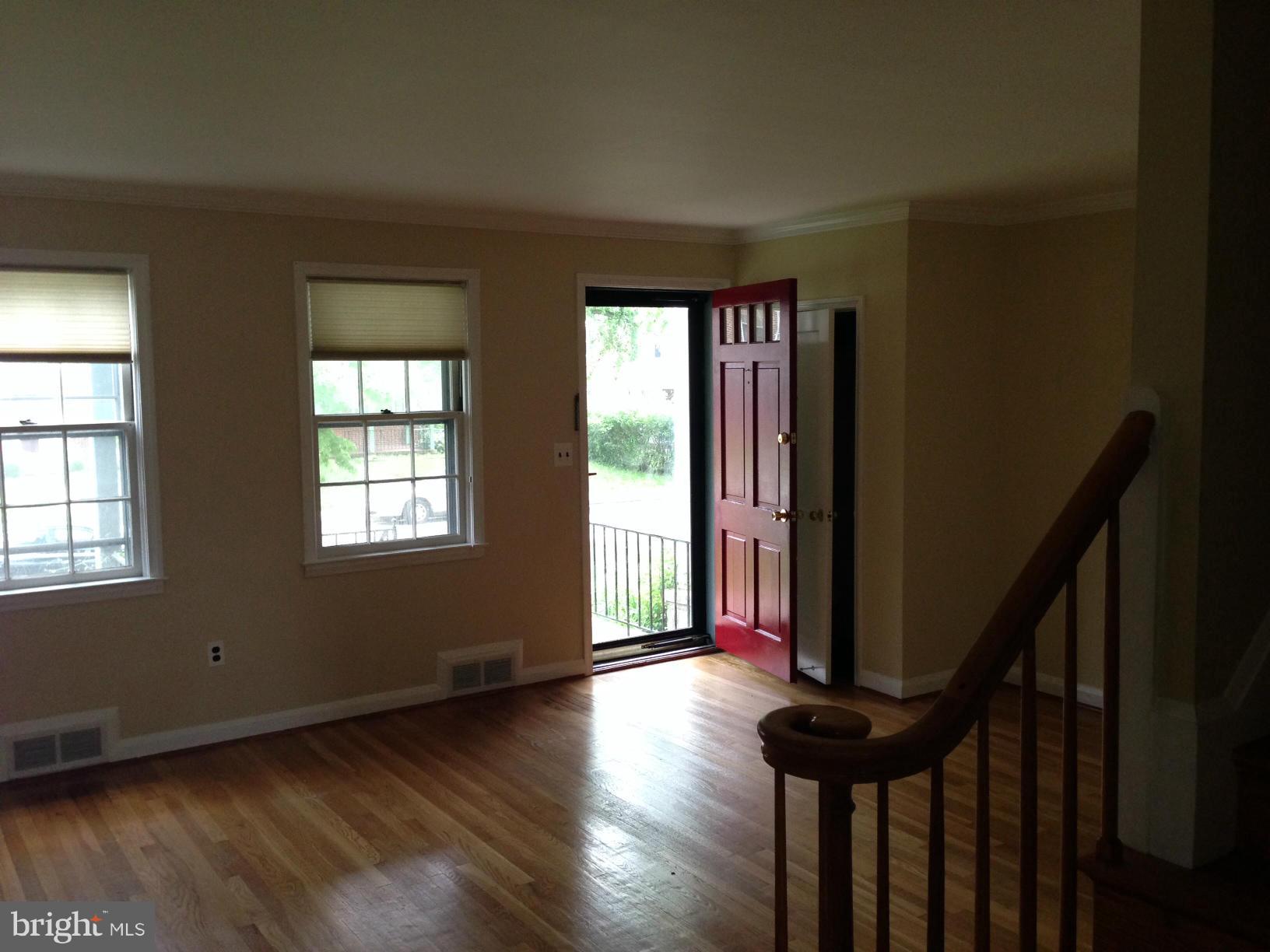 Three Bedroom Brick Townhome with New Stainless Stove, Dishwasher and Double Door Fridge. Renovated Bath, Hardwood Floors Throughout, Wainscoting and Brass Chandelier in Dining Room. Deep Back Yard w/ Large Deck, Parking Pad + Pad for Storage Shed. Lower Level RecRm w/ Bar, Half Bath, Recent Furnace, New Washer Dryer. READY FOR YOU!