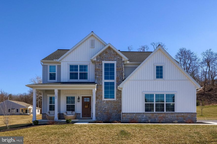 Welcome home to 168 Forge Dr—where thoughtful upgrades and elevated design set this property apart. Beginning with front porch to the desirable 2-car sideload garage with convenient mudroom entry, this home offers both style and functionality. The mudroom features a built-in bench and access to a spacious pantry that seamlessly connects to the kitchen. Inside, the first floor boasts 9’ ceilings and modern luxury vinyl plank flooring throughout. Just off the entry is a versatile flex room, perfect for a home office, additional living space, or playroom. The expanded kitchen is a true centerpiece, featuring quartz countertops, a tile backsplash, upgraded cabinetry with crown molding, and a large island with a farmhouse sink. Additional highlights include a built-in microwave, upgraded ventilation hood, and stainless-steel appliances. Adjacent to the kitchen, a sun-filled dining area provides easy access to the expanded rear patio, while the inviting family room features a cozy gas fireplace with a striking stone surround. Upstairs, the primary suite offers a spacious walk-in closet and an upgraded private bath with a tile shower and double vanity. Three additional bedrooms provide ample space, including one with an oversized walk-in closet or sitting area. A full hall bath and conveniently located second-floor laundry room complete this level. The finished basement is a standout feature—perfect for entertaining—with custom cabinetry, quartz countertops, built-in shelving, recessed lighting, and plenty of space for game days or movie nights. The home is conveniently located within walking distance to the popular Lebanon Valley rails to trails, along with a short drive from Iron Valley golf course, state game land and plenty of great hikes. Highlights that set this home apart include the expanded and upgraded kitchen, finished basement, enlarged rear patio, oversized seamless driveway with sideload entry, custom remote-controlled window treatments (included), and professionally maintained lawn care with recent fall seeding ready to shine this spring. This home truly stands above the rest—don’t miss your opportunity to make it yours.