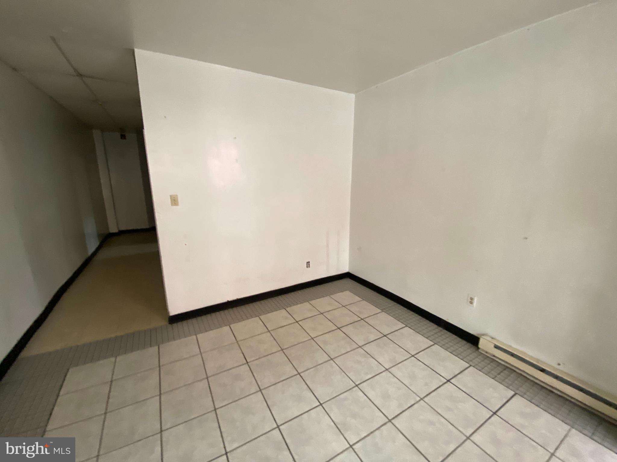 This large first-floor space is located in a prominent building just at the corner of 7th and Mifflin in South Philadelphia’s East Passyunk neighborhood! Ideal for professional offices, boutique service businesses, or creative studios. Reach out today to schedule a showing. The space features dual entrances—one at the front and one on the side—for added flexibility and accessibility. The open floor plan includes two large front-facing windows that provide excellent natural light and street visibility along 7th Street. Toward the rear, there’s ample room for desks, storage, or additional build-out options, along with a fully tiled half bathroom. The space can be thought of as a three-bedroom residence. You can even run your business here and sleep if you'd like! Lease Terms: First month, last month, and one month’s security deposit due at or before lease signing. Tenants responsible for electric and water (depending on use). Zoned CMX-1.