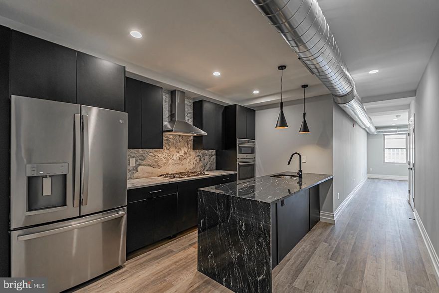 *Available NOW!*

This 2 bedroom, 1 bathroom unit in Hudson Liberties will take your breath away. Upon entering into the kitchen, you’ll notice the stark contrast of black and white granite counter tops, an island with a waterfall edge, and designer lighting above that reflects the copper glow on its surface. Complete with Danze kitchen fixtures and top of the line GE appliance package, the kitchen also includes a dishwasher, refrigerator, gas stove top with gourmet range hood, wall microwave and oven combination. In between the kitchen and living room is the washer/dryer closet. A decorative wall of floor to ceiling wainscoting gives the living room a classy and timeless look. The bedrooms are bright with large closets, east and south facing windows, including an unobstructed view of the Center City skyline! You’ll love the bathroom with European bath finishes, a double vanity sink, and a shower/deep soaking tub that offers maximum relaxation.

You will enjoy this premium location at 526 Brown St that is just steps from local restaurants like Federal Donuts and Honey’s Sit N Eat, as well as four blocks to the entire 2nd St Commercial Corridor, five blocks to the Spring Garden Subway Station and offers quick access to I-95 for zipping in and out of the city. All tenants have access to additional amenities including secure bicycle parking, a designated storage locker, and a 2,000 sq ft shared roof deck that offers panoramic views of the Center City skyline. The building also has a state of the art access control system with security monitoring.

Lease Terms: Generally, 1st month, and 1-month security deposit due at, or prior to, lease signing. Other terms may be required by Landlord such as last month’s rent upfront. $65 application fee per applicant. Tenants are responsible for: electricity, gas (if applicable), cable/internet. Water is a flat monthly fee of $75. Additional fees or requirements may be applicable for units with Homeowners or Condo Associations.  Landlord Requirements: Applicants to make 3x the monthly rent in verifiable gross income, credit history to be considered, have no evictions within the past 5 years, and must have a verifiable rental history with on-time rental payments. Exceptions to these criteria may exist under the law and will be considered. Cosigners will be considered.

*Price reflects the net effective rent when a 2-week credit is applied for $1,995/mo.
*1 cat permitted with owner approval, $350 non-refundable pet fee required.
*Small dogs under 35 lbs permitted with owner approval, $50/mo pet rent required.
*Photos are of an identical unit in the property (604)