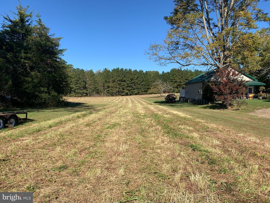 Over 17 acres of land in town  limits of Snow Hill.   Approximately 7 acres of high, sandy,  cleared land perfect to build on.   Potential for two lots and possibly more with right infrastructure.   Sewer and water available. The remaining  acreage is  wooded and river bottom land along the banks of the Pocomoke River.    Over 2 acres are  in the USDA Forest Conservation Program paying about $500 annually.    There are @ 80 feet of road frontage on Market St and additional access to the property off of Pine St.   Town taxes and rules apply.