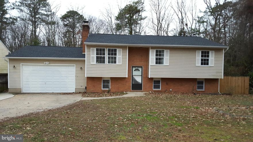 Gigantic open living,dining, kitchen area - 3 nice bedrooms with fans - 2 car attached garage - Beautifully updated modern baths - Large luxury master bath with Jacuzzi tub -  Lower level with Beautiful tree lined street - Large front yard & fenced rear yard - deck leads to above ground pool -  2 finished levels - laminate hardwood flooring - Come take a look, this home must be seen inside!