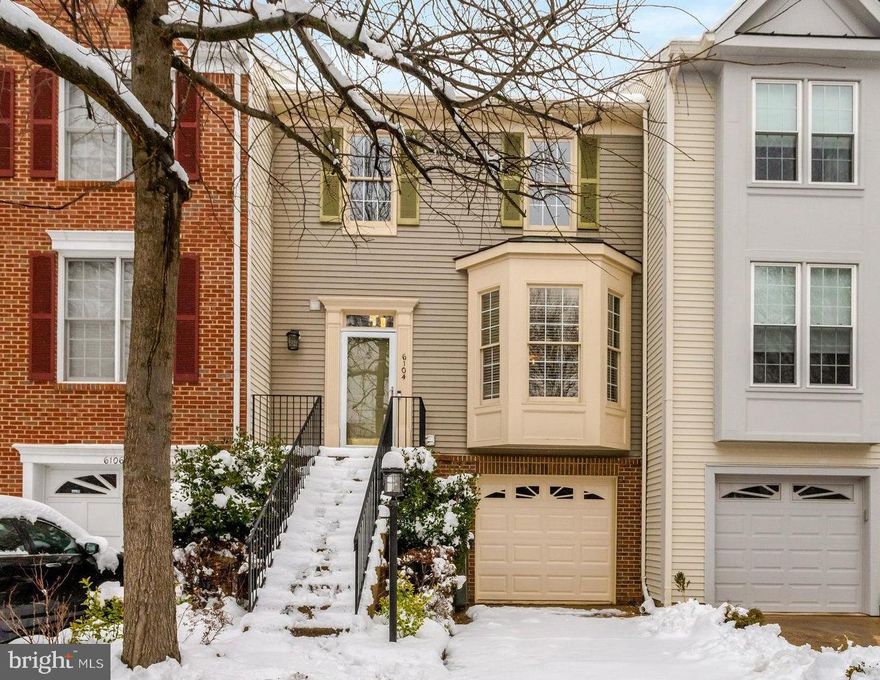 Welcome home! This three-level townhome boasts abundant modern updates, with an open floor plan, gleaming hardwood floors, high ceilings, neutral paint, and a magnificent outdoor space. On the main level, the bright and airy living room opens directly into the dining room, which features a sophisticated tray ceiling and elegant chair rail. This open concept floorplan is ideal for everyday life or entertaining! Continue into the home and you’ll find the light-filled eat-in kitchen, updated with modern Shaker-style cabinets, stainless steel appliances, sleek granite countertops, and a classic subway tile backsplash. Pull a stool up to the oversized island bar, or enjoy a casual meal in the adjacent breakfast nook. Upstairs, the primary bedroom suite boasts plush carpeting, a dramatic vaulted ceiling, and a large walk-in closet. The bright en suite bathroom features a wide double sink vanity, soothing soaking tub, and step-in shower. Both additional bedrooms include soft carpeted flooring, high angled ceilings, and wide closets with custom closet systems. They share a tasteful bathroom in the hall with plenty of cabinet storage. Downstairs on the lower level, the expansive recreation room offers a versatile second living space with vinyl plank flooring and recessed lighting. A large laundry room with a utility sink can also be found on this level of the home. From here, walk outside and enjoy relaxing in your screened patio or play in your backyard, fully fenced and surrounded by mature trees for  peace and privacy. Stairs connect to the wooden deck off of the kitchen, making the yard perfect for hosting bbqs with friends and family. On the front of the home, you’ll have access to the garage and driveway, giving you plenty of space for both storage and parking. Conveniently located just minutes to Safeway, Giant, Wegmans, Kingstowne Towne Center, Springfield Town Center, Huntley Meadows Park, Kingstowne South Center and Pool, Fort Belvoir, and The Pentagon. Quick access to Franconia-Springfield Parkway, Van Dorn Street, I-95, I-495, and Telegraph Road, as well as the Van Dorn Street and Franconia-Springfield Metro Stations. Schedule a private tour of your beautiful new home today!
