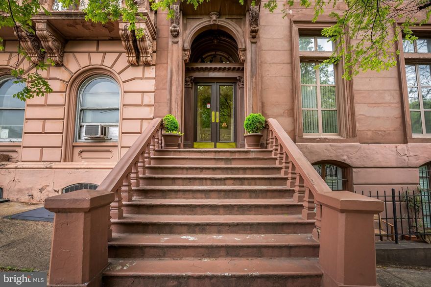 Located in the heart of Mount Vernon, this condo combines historic character with modern design and convenience. The exterior is as impressive as it is pristine, situated across from some of Baltimore’s most iconic structures, including the Peabody Library and the Washington Monument. You and your future guests will marvel at the grand foyer featuring marble flooring, handmade woodwork, and intricate crown molding. Inside the condo unit, you'll be charmed by a cleverly designed foyer that doubles as an office space. From this penthouse level condo, your eyes will be drawn to the unobstructed, stunning view through a wall of windows, where cherry trees, the Peabody Library, the Walters Art Museum, and the Washington Monument can all be admired from this rare vantage point. The open-concept living area seamlessly blends the kitchen, living, and dining spaces, enhanced by original hardwood floors and ceilings. The kitchen is both functional and visually appealing, with a large island that provides plenty of prep space and serves as a breakfast bar. It also features stainless steel appliances, a hood vent, ample storage, and a hidden entrance to the washer and dryer. The oversized built-in couch offers a cozy spot to lounge and read, while doubling as hidden storage. The updated full bathroom includes hexagon tile flooring and a floating sink with a marble top. Through the pocket doors, you'll find a spacious bedroom with room for a king-sized bed and additional furniture. The historic building offers convenient amenities such as an elevator, private storage lockers, and a shared outdoor courtyard. Water and sewer are included in the monthly condo fee. Mount Vernon is centrally located in Baltimore City and is home to some of the city's best restaurants, cocktail bars, nightlife, and vibrant arts and culture scene. It’s close to Penn Station, with easy access to bike and bus routes, as well as I-83. Schedule your tour today.