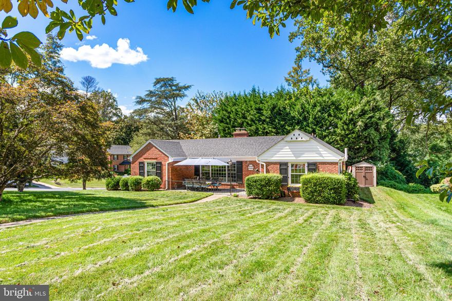 Welcome to 7100 Western Avenue, a delightful single-level home on a generous corner lot in the heart of Chevy Chase’s sought-after Rollingwood neighborhood. With 3 spacious bedrooms and 2 full baths, this home offers the perfect blend of comfort, charm, and everyday convenience.

Step inside and you’ll immediately feel the warmth of the light-filled living room, where oversized windows invite in sunshine and create a cozy, welcoming space to relax or gather with loved ones. The kitchen is both stylish and functional, featuring granite countertops, stainless steel appliances, and light wood cabinetry, while big windows bring the outdoors in. A dedicated dining area nearby is ideal for enjoying meals together or hosting friends.

The bedrooms provide plenty of room to unwind, along with generous storage. Recent updates—including a new roof, all new windows, and an upgraded HVAC system—add peace of mind, comfort, and energy efficiency.

Life extends easily outdoors with two private patios designed for relaxation and entertaining. The back patio, complete with a built-in fireplace, is perfect for cozy evenings, while the fenced front patio offers a private retreat for morning coffee or playtime. A paved driveway ensures everyday convenience.

Best of all, you’re just a short stroll from Rock Creek Park and Candy Cane Park, where trails, playgrounds, and green space become an extension of your backyard. This is a home that makes it easy to enjoy the best of both indoor comfort and outdoor living.