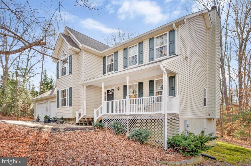 Discover the perfect blend of privacy, comfort, and convenience in this beautifully maintained Island Creek Woods colonial.  Nestled on a wooded 1-acre homesite, the location offers an easy commute to Washington, D.C., NAS Patuxent River, and Annapolis - ideal for those who want tranquility without losing access to key destinations.

Inside, a freshly painted open layout sets the tone for gatherings around the wood-burning fireplace.  The kitchen area extends naturally to a screened porch overlooking the backyard, while a welcoming front porch invites you to slow down and enjoy the setting.  

Thoughtful updates bring peace of mind, including a 2023 roof with new gutters, gutter guards, shutters and shingles. Updated dual-zone HVAC (2021/2019), and a new hot water heater (2023).  The kitchen features modern GE stainless and slate-finish appliances, complemented by durable LVT flooring (all replaced in 2022).  New carpet (2025) adds comfort to the upper level and dining room.

Enjoy 4 bedrooms, 2 full baths, 2 half baths, a fully finished basement and an attached 2 car garage.  Energy-efficient construction with SMECO’s Power Saver package and included appliances - washer, dryer, and a bonus basement refrigerator make this home truly move-in ready!