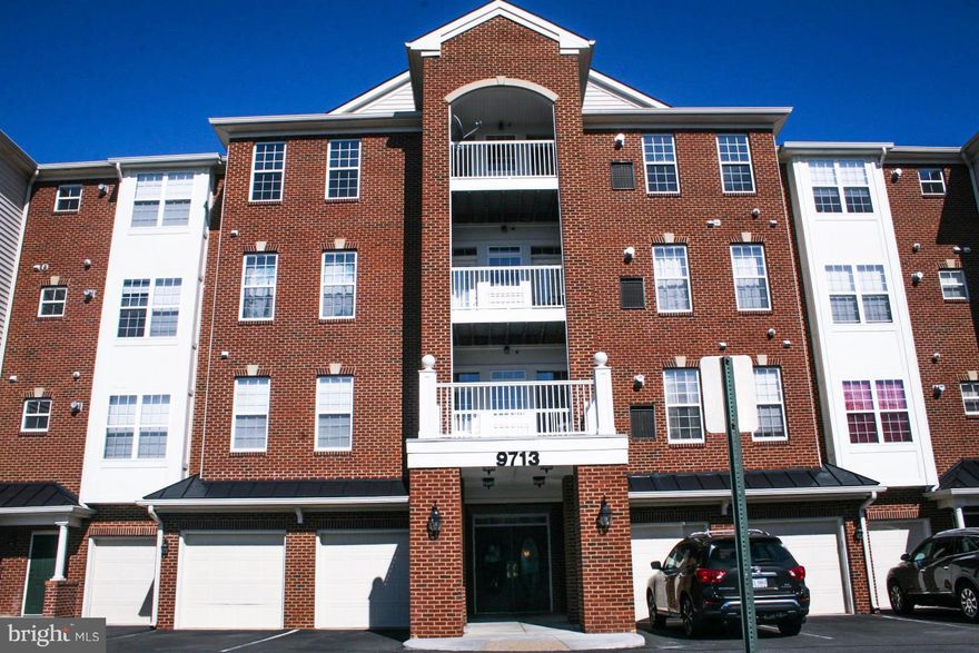 Location! Parking is right front of entrance. Unit close to elevator! Beautiful sunlit end unit! Kitchen w/beautiful cabinetry, granite/tile/large breakfast room. Formal DR or room could be used as an office. Lovely balcony. Spacious master bedroom w/2 walk-in closets & luxurious bath w/beautiful tile, granite, soaking tub & sep. shower. Only 5 min walk to VRE which can take you into DC/Alexandria