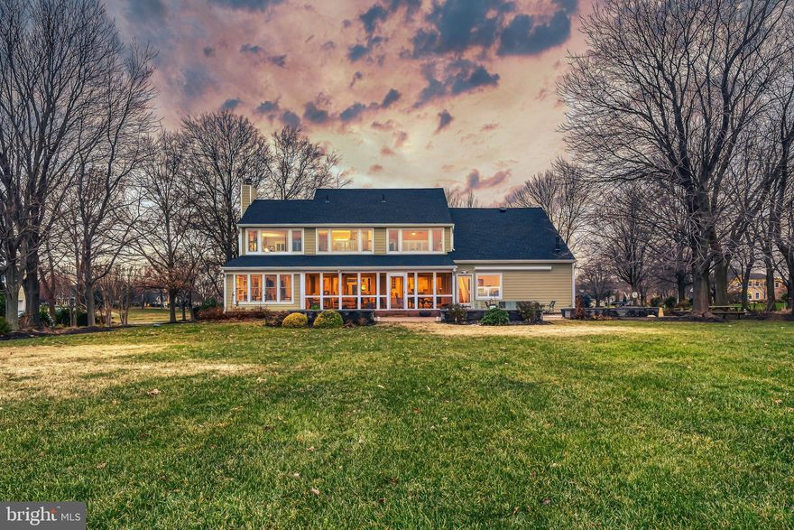 Beautiful Southwind waterfront home! Incredible broad water views! Custom inlaid hardwood floors throughout! Super 2 story entry foyer with extended views! Huge white eat in kitchen with dining area! Gorgeous living room featuring gas log fireplace, decorative mantle, slate hearth + built-ins. Adjacent waterfront den w/ floor to ceiling collection display shelves, brick floor & recessed lighting.  Main level home office! Huge screen porch w/brick floor, ceiling fans, recessed lighting + 60 foot brick patio. Upper level primary bedroom & primary bath both with stunning water view,  plus 2 more bedrooms.  Giant upper level game room featuring wet bar, pool table, decorative flooring, built-ins & custom lighting. Extras include: fire pit, retractable awning, generator, pool table, custom draperies, moldings, third bay garage storage, martin houses, and pier with new decking and boat lift!