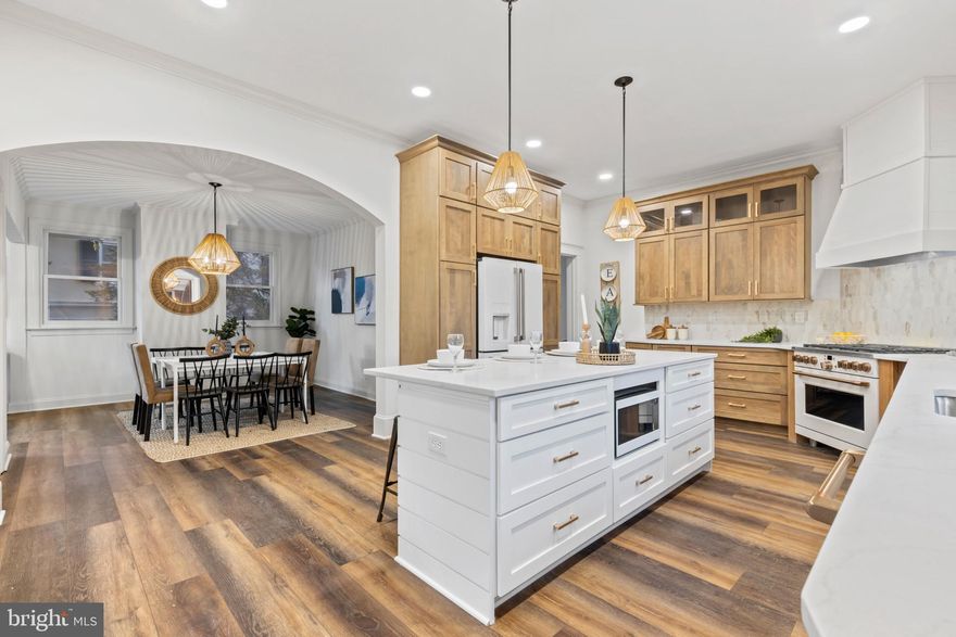 Price Improvement! Fully Renovated Roland Park Victorian with All New Gorgeous Finishes throughout! This 5 Bedroom 3 Full and 1 Half Bathroom home has over 4,600 sq. ft. of living space and has been reimagined from top to bottom.  Perfectly situated within quick walking distance of the areas best Restaurants, Petit Louis Bistro and Johnny's, this home is not to be missed! No HOA and ample Parking with an Oversized Detached 2 Car Garage and additional multi car parking pad adjacent to garage. A Neutral Modern color palate welcomes you throughout this light and bright home. The Kitchen features white GE Café Appliances w/ brushed bonze accents, white center shiplap island, and natural wood tone cabinetry. A formal dining and a breakfast nook outline the kitchen, with an additional gathering room off the back . An expansive primary suite w/ walk-in closet and  lush en-suite bath can be found up on the second level via the original rounded staircase, along with 2 additional spacious bedrooms and another full bathroom. The home keeps expanding up onto the third level with 2 more sizeable bedrooms and another perfectly accented full bathroom. This beautiful home has been thoughtfully renovated and updated, while managing to keep a few original accents throughout, truly is a must see!