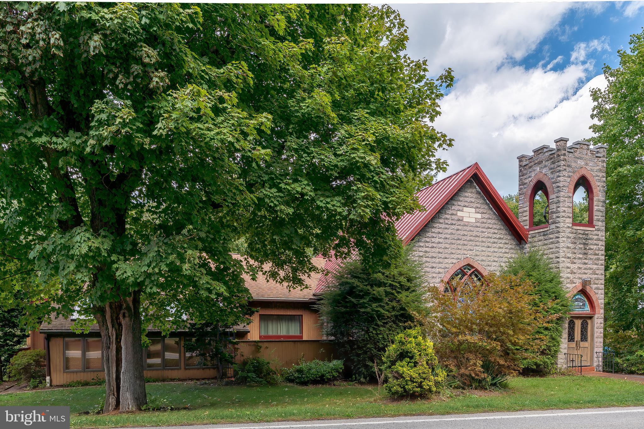 It has been said that your home is your sanctuary. Nestled in the small town of Lisburn, Pennsylvania, this historic, gothic style church could make the perfect home for you or someone that you know. Converted into a home in 1985, this property contains many of its original church features.   With wood flooring, eight stained glass windows, and a 21 foot cathedral ceiling peak, the 1,200 square foot sanctuary is perfect for entertaining guests.   This could be an incredible studio residence for artists, designers, musicians and creative types. In addition, the zoning for in-home occupations provides for a variety of options.  In addition, you will find several additional stained glass windows throughout the home as well as the bell tower and choir loft. The open kitchen with custom cherry cabinets and breakfast bar looks out onto the sitting room, just steps away from the sunroom and hot tub leading to a private patio.  Imagine the possibilities of this home.  With an additional 12 x 30 apartment above the garage, enlarged carport, walk out lower level, there are so many options.   In addition, this property borders the spectacular 110 acre Lower Allen Community Park. Activities at the LACP include:  basketball, softball, tennis, volleyball, horseshoe pitching, fishing in Yellow Breeches Creek, bass pond fishing (for children 12 and under), bike riding, play areas, Field of Dreams (Fun Fort) Playground, golf driving range, nature trail, and a wildlife and bird watching area.  In addition, cross country skiing and sledding are popular activities during the winter months. LACP is also home to the “Doggie Dugout”, a park for dogs to run and play off-leash.  This former church saw many conversions in its day. Remodeled in the 1980’s, this one-of-a-kind residence is ready for your touches and updates. We’re excited for it to be converted into your next home.