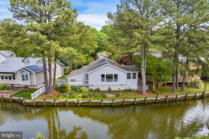 Nature Lovers’ Paradise!
Your new home at 28 Watertown Rd. in Ocean Pines features a breathtaking
view of Manklin Creek! Enjoy your morning coffee at your large picture window
watching the herons, egrets, geese, eagles, osprey, ducks, and otters cavort! It’s
a different show every day, according to the current owner!
This 3-bedroom, 2 bath home has been widely updated in the last ten years and
features an open-floor plan, sunroom and wood floors.  *Roof roughly 10 yrs old * Brand New Washer & Dryer-Speed Queen* 2yr old Water Heater* Some Ceiling Fans are New* HVAC recently redone and new in-line air cleaner* Primary bath was redone about 3 yrs ago* New flooring,*  Some New Windows* Newer Appliances*.  Ready for move in!   A single-car garage and
wide blacktop driveway invite your guests to visit. Extensive flower beds and
hardscaping enable you to enjoy your stunning view from either the deck or the
backyard patio.
Get away from the traffic and relax in your new water-front home. Forget
canals and watch the beauty unfold on Manklin Creek!