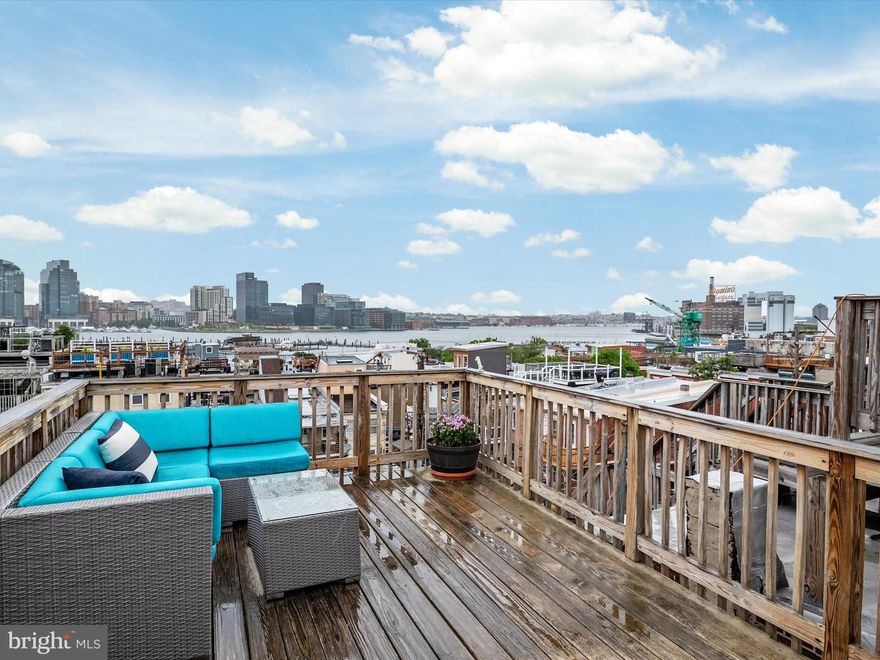 Welcome to 628 E. Fort Avenue, a spacious Charm City gem boasting 3 bedrooms and 3.5 bathrooms.  Please note that the actual finished square footage of the home is 2,163 sq. ft.  FULLY renovated in 2016, this home offers the perfect blend of original charm and modern comfort—featuring engineered hardwood floors, exposed brick, beautiful coffered ceilings with crown molding in the living room, and tall ceilings/windows throughout.   Best of all, private two-car parking—a rare find in city living!  The spacious kitchen comes equipped with custom cabinetry and built-ins around the refrigerator for additional storage.  Each of the two upstairs bedrooms has its own en-suite bathroom and the finished basement includes a third bedroom or flex space plus a full bathroom—great for guests, a home office, or gym. Enjoy three private outdoor spaces: a deck off the kitchen, a second deck off the bedroom, and a rooftop deck with city and harbor views. Some of the recent upgrades include cement board siding on the side and back of home (2020), new 40-year vinyl membrane front top roof (2021), new storm doors on three levels (2021), and a rooftop deck door (2021).  Walk to Riverside Park, Cross Street Market, Little Havana, The Wine Collective, and more.