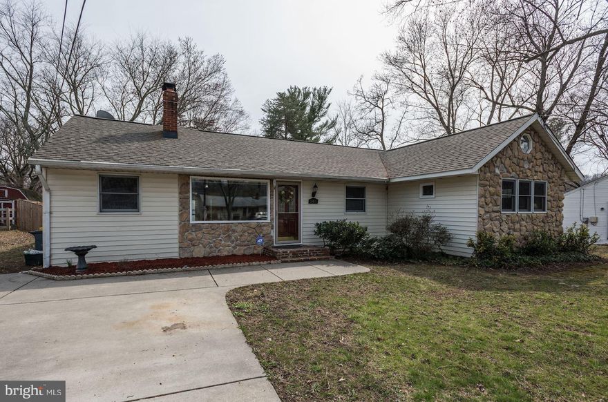 Rare 4-bedroom rancher with over 1,900 sq ft of bright & airy living spaces. Carefully maintained. Recent updates incl. architectural shingles, kitchen, baths, windows. Huge living room with cathedral ceiling & French doors opening to wraparound Trex deck. Large fenced-in backyard & det. 2-car garage/workshop & 2-bay carport. Driveway parking for 6 cars. Blocks from the water, convenient to Rte 2.