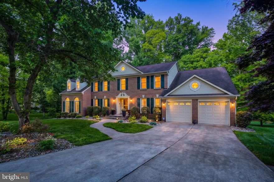 Welcome to 8368 Sand Cherry Lane in the highly sought after Cherrytree Farm community—where timeless elegance meets exceptional living! This stately brick front home, the largest model offered in the neighborhood, is perfectly situated on a wooded lot with stunning outdoor and indoor living spaces designed for both relaxation and entertaining. Step inside to a grand two-story foyer adorned with an impressive chandelier and the formal living and dining room on either side. Both rooms feature classic chair rail and crown molding. The home boasts a rare and desirable upgrade with the breathtaking two-story sunroom with a loft. The bright and airy sunroom offers vaulted ceilings, large casement windows, and panoramic views of the surrounding landscape. The thoughtfully expanded and remodeled kitchen (2012) is a chef’s dream, featuring warm medium tone wood cabinetry, granite countertops, ceramic tile flooring, and a striking center island with breakfast bar seating at the end. Additional highlights include a coffee bar with second sink, stainless steel appliances (gas cooktop, double wall ovens, refrigerator, dishwasher, built-in microwave) and stylish pendant and recessed lighting. The kitchen flows seamlessly into the breakfast room with a bay window and the dramatic two-story family room. The family room showcases skylights, hardwood floors and a cozy wood-burning fireplace. A private study with French doors, custom built-in shelves and cabinetry along with a convenient powder room completes the main level. Upstairs, you’ll find four spacious bedrooms and three full baths, including a luxurious primary suite featuring a sitting room, expansive walk-in closet and spa-like bath with Jacuzzi jetted tub, two sink vanity with makeup counter, tiled shower with bench and private toilet room. Bedroom 2 offers its own ensuite bath, while bedrooms 3 and 4 share a well-appointed Jack-and-Jill bathroom with two sinks and a separate shower/toilet area making it easy to share the space. The fully finished walk-out lower level is an entertainer’s dream—highlighted by a dedicated theater room with a theater riser for optimal viewing, built-in speakers and dim ambient lighting. There's a temperature-controlled wine cellar with custom wood racks, a recreation room with wood-burning fireplace and a full bathroom. Two additional storage rooms provide ample storage space for seasonal items. The outdoor space is equally impressive with a composite deck off the kitchen and family room and a beautifully designed patio with a pergola draped in wisteria. Really enjoy the serene setting of the wooded backdrop this Spring and Summer! Improvements & updates include: 2023 - Family Room & Office Windows, 2022 - Sunroom Windows, 2021 - Upper Level Window, 2021 - HVAC for Sunroom, 2020 - Pergola, 2019 - Patio & Retaining Wall, 2019 - Front Walkway, 2016 - Hardwoods In Sitting Room & Primary Walk-In Closet, 2016 - Upper Level Carpets, 2015 - HVAC for Main Level, 2015 - HVAC for Upper Level, 2014 - Hardwoods In Family Room & Study, 2013 - Water Heater. Howard County Public School System! Minutes from Maple Lawn’s shopping, dining and entertainment! Ideal for commuters with easy access to I-95, Route 29 and Route 32, offering convenient travel to Baltimore and Washington, D.C. One year home warranty included for the Buyers! This exceptional property truly has it all—schedule your showing today!