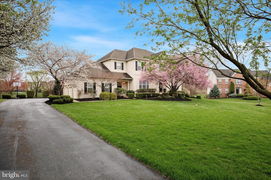 Welcome to refined suburban living at its finest in the prestigious Wainwright at Whitemarsh community. This stunning Colonial home blends timeless elegance with modern comfort, nestled on a beautifully landscaped lot adorned with mature trees and vibrant seasonal blooms. As you arrive, the curb appeal is undeniable—setting the tone for the exceptional living experience inside. Step through the grand, two-story foyer where gleaming hardwood floors and an abundance of natural light immediately impress. The expansive floor plan flows effortlessly, beginning with a sunlit formal living room and a sophisticated dining room accented with classic wainscoting—perfect for elegant dinners and festive gatherings. A versatile bonus room offers the ideal space for a home office or cozy sitting area. At the heart of the home lies a spacious, gourmet kitchen featuring crisp white cabinetry, a central island with seating, recessed lighting, and generous dining space. A charming additional seating nook by the sliding glass doors offers the perfect spot to enjoy morning coffee or unwind with a book. The adjacent great room is both inviting and dramatic, showcasing a coffered ceiling, plush wall-to-wall carpeting, a cozy gas fireplace, and sun-drenched windows that fill the space with warmth and light. Completing the main level is a well-appointed powder room and a laundry room, adding convenience to everyday living. Upstairs, the luxurious primary bedroom is a private retreat with a generous layout that includes a sitting area, an oversized walk-in closet, and a spa-like ensuite bathroom with dual vanities, a soaking tub, a glass-enclosed shower, and a semi-private water closet. Two additional bedrooms have their own walk-in closets and share a well-designed Jack and Jill bathroom, while a fourth bedroom with its own full bathroom is perfect for guests or in-laws. The fully finished lower level is an entertainer’s dream, complete with a wet bar, plenty of seating, expansive recreational space, an additional powder room for guests and ample storage space. Step outside to your own private oasis—an expansive deck with a pergola overlooks the serene backyard, offering the ideal setting for outdoor dining and relaxation. Additional highlights include an oversized three-car garage and a spacious driveway, providing ample parking for family and guests. Located within the award-winning Colonial School District and zoned for Ridge Park Elementary, this home also offers easy access to major roadways, shopping, dining, and more. 205 Kensey Road is more than just a home; it’s a lifestyle. Don’t miss your chance to make it yours!