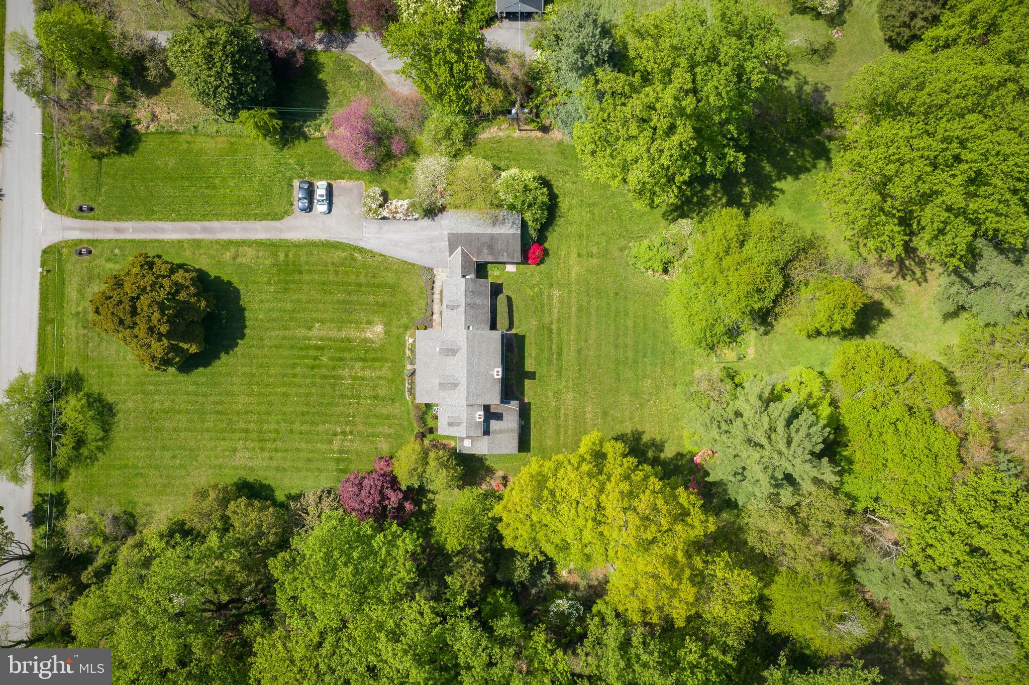 An incredible opportunity to own almost 4 estate-quality acres in the heart of the Potomac Village. The picturesque site, with wide open frontage, sprawling lawns, and mature trees, provides an idyllic, tranquil setting, perfect for a refuge from the bustle of Washington DC. The existing on the property house was built in 1957 and later was updated by the original owners. The main level of this three-story home features: large living/dining room with the oversized windows overlooking gorgeous vistas of the private grounds, a spacious study, a kitchen with a breakfast nook, a sunroom, an office/bedroom, a full bath, and a mudroom. Upstairs there are four bedrooms and two full baths. Partially finished basement, two-car garage, a breezeway, and a lovely front porch complete this charming home. Coveniently located, just off the prestigious River Road, on the block with multi-million $$$ homes, this spectacular property is close to the Village center (0.6 miles), and offers an easy access to major commuting routs, three airports, the area's fine shopping, dining, schools, and wide range of museums, sports venues, and cultural centers. Truly a one-of-a-kind property, unlike anything else in this area. Exceptional and rare opportunity to build your dream country estate! To fully appreciate the breathtaking beauty of this land, take a look at the AERIAL VIDEO... and imagine the possibilities...