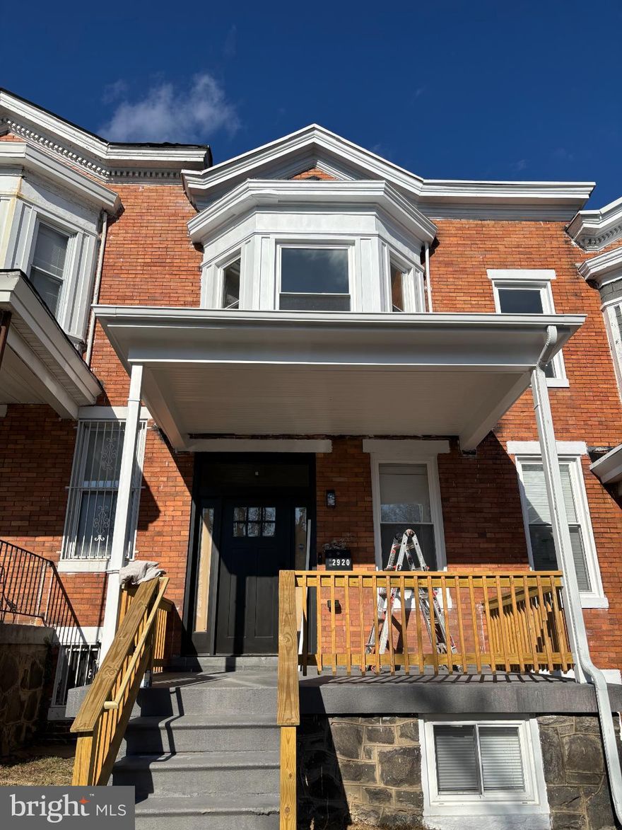 Exquisite bungalow-style townhouse that presents a unique opportunity to embrace a luxurious lifestyle in your dream home. A complete top-to-bottom renovation has been completed, featuring all new plumbing, electrical, and HVAC systems.  The renovation has provided modern updates while maintaining the historical charm.  Spanning more than 1,440 square feet, this residence boasts three spacious bedrooms and two and a half elegantly appointed bathrooms. A large entry area flows into the generous living room and dining room.  The heart of this home is undoubtedly the gourmet kitchen, featuring an inviting island and a spacious pantry, perfect for culinary enthusiasts and casual cooks alike.  The primary suite is a true retreat, featuring a bay front design that floods the room with natural light, complemented by a generous walk-in closet and a beautifully designed primary bath. The thoughtful layout ensures comfort and privacy, making it an ideal sanctuary for relaxation. Two more spacious bedrooms and a full bath make up the rest of the second floor.  Step inside to discover a harmonious blend of modern elegance and classic charm. The interior showcases stunning heart of pine hardwood floors that flow seamlessly throughout the main living areas, while plush carpeting adds warmth to the bedrooms. Recessed lighting enhances the ambiance, creating a welcoming atmosphere perfect for both entertaining and quiet evenings at home. The partially finished basement offers additional versatility, whether you envision a cozy media room or a home gym. With a connecting stairway, this area can easily be transformed to suit your lifestyle needs. The spacious backyard provides ample options for barbecue and gardening opportunities.  Located in a vibrant urban setting, this property provides easy access to a plethora of dining, shopping, cultural experiences and easy access to Coppin State. This residence is not just a house; it's an invitation to a lifestyle of comfort, elegance, and personalization. You have the chance to shape this space into your ideal haven. Embrace the opportunity to create a home that reflects your unique style and aspirations.