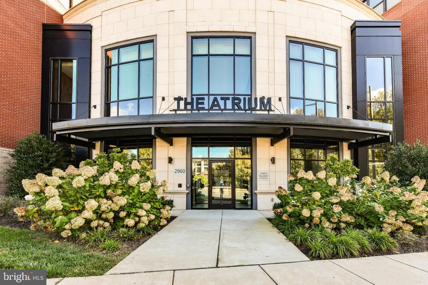 Nestled in the heart of the serene and vibrant 55+ community at The Atrium at Metrowest, this exquisite 2-bedroom, 2-bathroom residence offers a refined lifestyle of comfort, luxury, and convenience. Built in 2020, this beautifully designed mid-rise apartment showcases a contemporary open floor plan that seamlessly blends sophistication with everyday functionality.
Step inside to discover a chef-inspired kitchen featuring upgraded countertops, stainless steel appliances, a spacious island ideal for entertaining, and a water filtration system for pure, fresh drinking water. The gourmet kitchen flows effortlessly into the combined dining and living area, highlighted by elegant recessed lighting and gorgeous hardwood floors.
The home boasts over $15,000 in custom built-in cabinetry—thoughtfully designed to provide smart, stylish storage throughout, while enhancing the beauty and organization of every room.
The floorplan offers both comfort and practicality, with an entry-level bedroom for added convenience and a luxurious primary suite that serves as a true retreat. The primary suite includes a generous walk-in closet and a spa-like bathroom with a walk-in shower.
Beyond the walls of your home, The Atrium at Metrowest delivers resort-style amenities to support a vibrant, active lifestyle. Enjoy year-round relaxation in the heated indoor pool, stay fit in the well-equipped fitness center, or take a stroll along the scenic trail. Socialize with neighbors in the elegant clubhouse and party room, or let your furry friend roam free in the community dog park.
Additional features include: Secure basement garage parking, 24-hour security and on-site resident manager, outdoor courtyard for grilling and entertaining, indoor pool, gym, yoga room, community room, secure storage locker for deliveries, association fee covering water, trash, and lawn care for a truly low-maintenance lifestyle
Perfectly located right next to the Vienna Metro and just minutes from Tysons Corner and the Mosaic District, you'll enjoy easy access to premier shopping, dining, and entertainment. Grocery stores less than two miles away.
This is more than just a home—it's an invitation to embrace a lifestyle of elegance, ease, and community connection. Welcome to The Atrium at Metrowest.