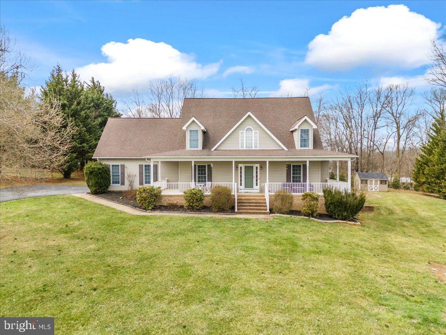 Welcome to this beautifully maintained Cape Cod home, perfectly situated on 1.06 acres of picturesque land. This charming property offers a seamless blend of comfort and style, starting with the inviting wrap-around front porch that provides stunning views of the serene surroundings.

Inside, the main level features a spacious primary suite, offering convenience and privacy. The living room boasts soaring high ceilings and a cozy fireplace, with a loft above that overlooks this impressive space. Upstairs, you’ll find three generously sized bedrooms, perfect for family, guests, or a home office.

The finished basement adds even more living space, featuring a second fireplace and an additional storage room with rough-in plumbing, ready to be finished into a bathroom. Modern updates include a newer roof and HVAC system, both installed around 2019, ensuring peace of mind for years to come.

Step outside to enjoy the extended back deck, perfect for outdoor gatherings, or relax on the expansive front porch while taking in the scenic views. This home’s location is unbeatable—just 10 minutes from historic downtown Harpers Ferry, grocery stores, entertainment, and schools, and only 20 minutes to the MARC train for an easy commute.

Don’t miss the opportunity to own this beautiful and well-maintained Cape Cod home with the perfect mix of charm, space, and convenience!