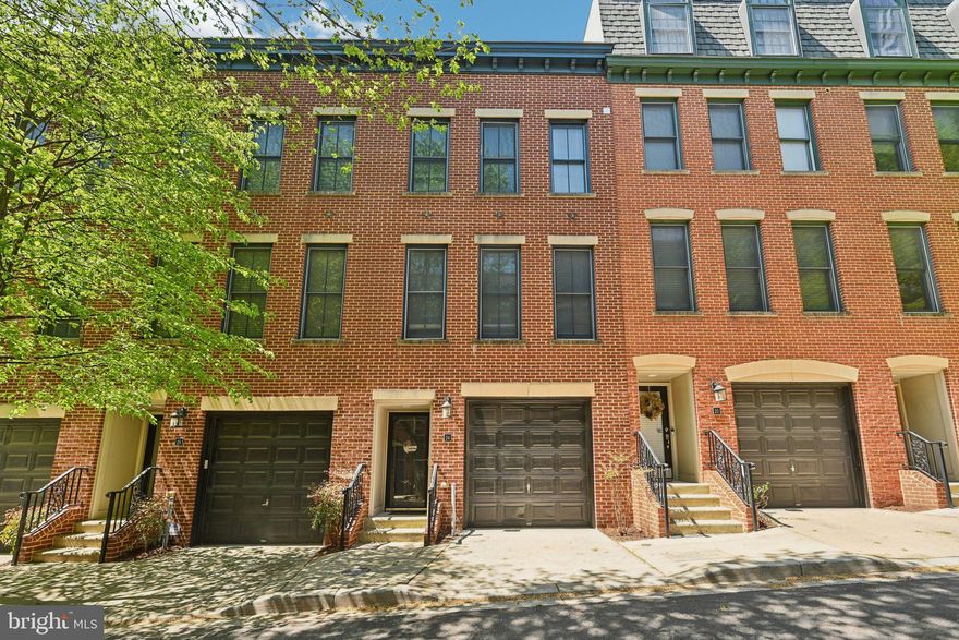 Welcome to this stunning 3 bedroom, 3.5 bath home tucked into one of the most desirable pockets of Fells Point. Offering the perfect blend of city living and modern comfort, this spacious multi-level home features hardwood floors, high ceilings, oversized windows, and an open-concept main level designed for both everyday living and entertaining.

The beautifully updated kitchen includes granite countertops, stainless steel appliances, abundant cabinetry, gas cooking, and a large breakfast bar overlooking the main living and dining spaces. The living area is warm and inviting with a gas fireplace and custom built-ins.

The flexible floor plan offers two potential primary suite options, each with its own private bath and generous closet space, making the layout ideal for guests, roommates, or multi-generational living. One of the suites features a large soaking tub, while another level offers direct access to a private balcony.

Outdoor living is a standout feature with two rooftop balconies showcasing incredible city skyline views—perfect for entertaining, relaxing, or enjoying Baltimore sunsets. Rare for city living, the home also includes a private garage for convenient off-street parking.

Located in a charming courtyard-style community with beautiful lighting and landscaping, this home is just moments from the waterfront, restaurants, shopping, nightlife, and everything that makes Fells Point one of Baltimore’s most sought-after neighborhoods.