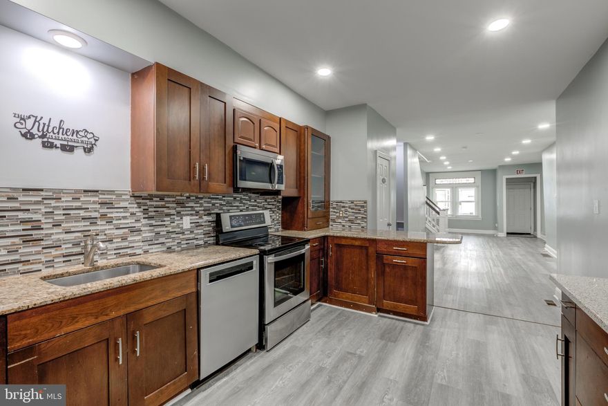 Welcome to 5839 Christian St, a beautifully renovated row home located in the heart of Cobbs Creek. This spacious property was originally a 4-bedroom, 1.5-bath home and has been converted into 6 bedrooms and 2.5 bathrooms, offering a modern layout with flexible living space perfect for today’s lifestyle.

The main level features an open floor plan with recessed lighting throughout and a fully remodeled kitchen in the rear of the home. The kitchen is equipped with stainless steel appliances, granite countertops, and ample cabinet space—ideal for everyday cooking and entertaining.