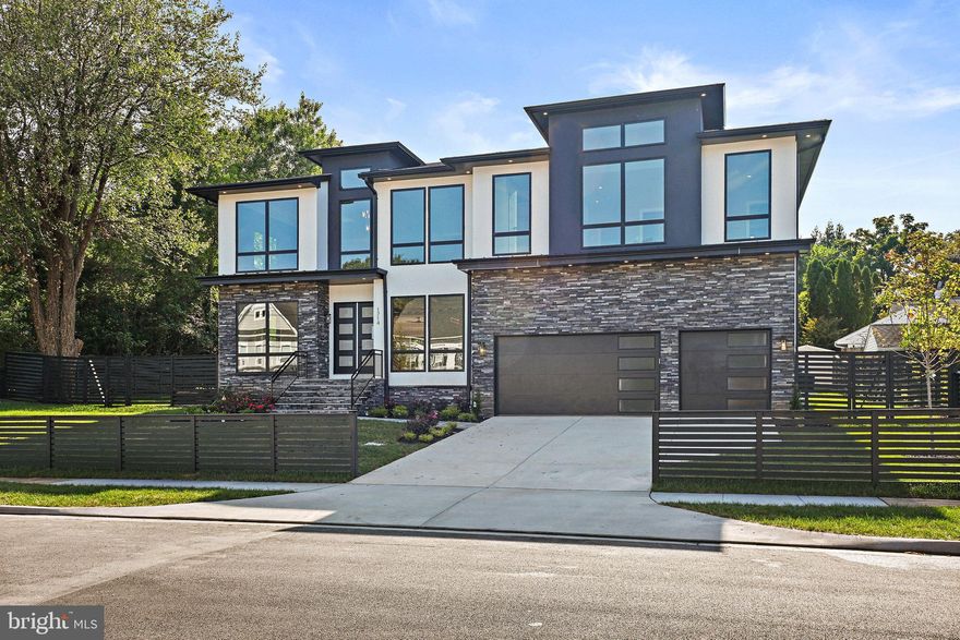 A stunning contemporary style home with an open concept floor plan and modern finishes in a highly desirable community in McLean coming soon! This fabulous architectural masterpiece home has all the amenities with 7,639 square feet of total finished floor area that a family would desire in their dream home. This home features a 10 feet ceiling at the main level and 9 feet ceiling at the second-floor level. There are 6 large bedrooms, 6 full spacious and luxurious bathrooms, 2 half bathrooms, 3-car garage, Pella Lifestyle black windows, walkup basement, rear covered porch, open composite deck. Mudroom has built-in cubbies and a bench with a separate dog wash area. Magnificent in every way, spacious, dramatic, refined, and elegant. Upon entering the home, you are greeted by an alluring modern foyer, living spaces full of natural lights, and solid oak hardwood floors. The spacious formal living area and stunning dining room offer the perfect combination of elegance and sophistication. Every family's dream in the Gourmet chef's kitchen has Thermador stainless steel appliances. There is also a separate prep kitchen and pantry with stainless steel appliances. The family room area is truly spectacular that includes a gas fireplace, built-ins, and tall windows. The thoughtfully designed second floor offers a luxurious owner's suite with a large walk-in closet, a deep soaking tub, and a glass shower. The upper level also features 3 additional large bedrooms with full bathrooms. All rooms are generous in size and drenched in natural light. The finished basement includes a modern wet bar, exercise room, media room, and spacious bedroom with an attached bathroom. Can accommodate a pool.