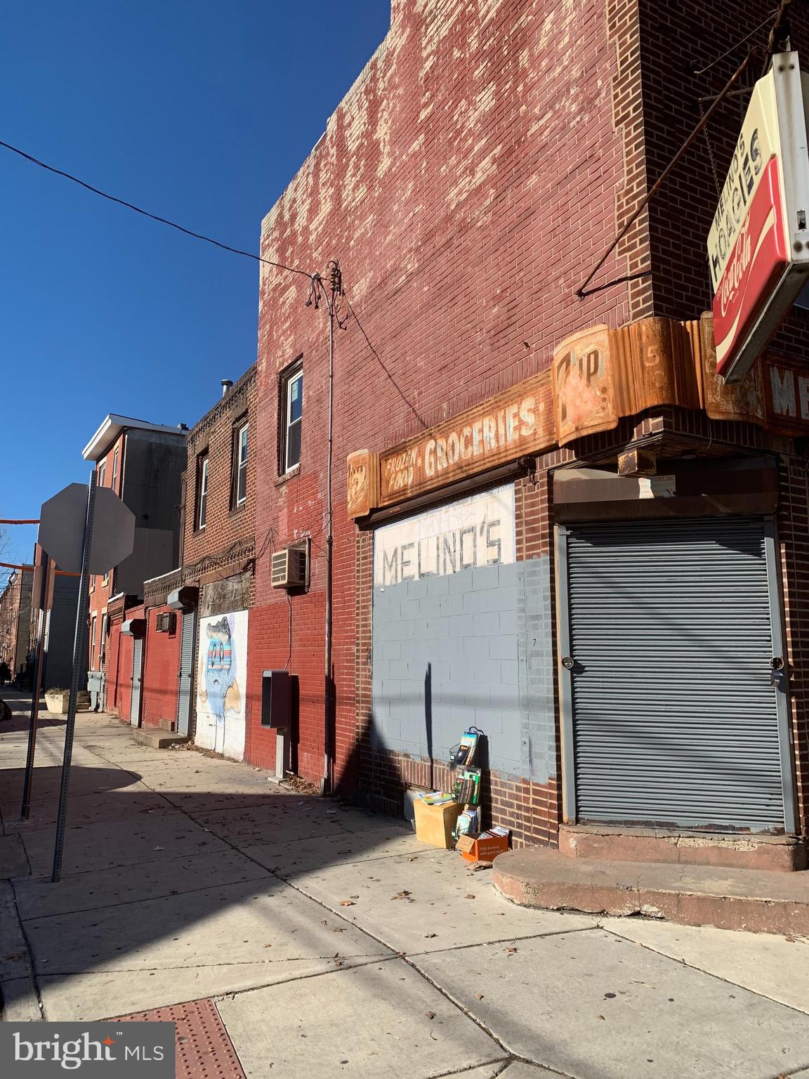 Incredible Opportunity for Investors and business owners in the popular Newbold Area! This huge Mixed Use corner property has commercial space for a business on the ground floor with 2 apartments above! This corner was a generational hoagie shop for years and is sadly missed by the community. As you enter you can envision your business whether it’s a grocery store, retail store, office…countless options! Make it work for you! In the rear of the first floor is a storage room, powder room and walk in refrigerator (currently not in working condition.) The basement door in this area is open for easy access to the downstairs mechanicals. On the Ellsworth street side of the property is the door that opens up to the two residential units which currently are shells in need of total rehab and renovation. Seller did install new windows on second and third floors. This could be a major income producing property! Current rents range from $1200/month to $1600/per month in this area. THIS HAS GREAT POTENTIAL! PROPERTY BEING SOLD AS IS. This location is surrounded by new construction. Close to center city, shopping, restaurants, sports complex, Philly Intl airport, 30th Street Station and Live Casino. The historic Italian Market, Passyunk Avenue, Starbucks, Sprouts, Target and Insomnia Cookie minutes away. Great location for commuters using Septa bus or subway lines. Close to major highways, I-95, Schuylkill Expressway, Walt Whitman and Ben Franklin Bridges. Fantastic for walkers or bikers! Come Take a Look! This property is in need of renovation and proof of funds are required for purchase.
Property is being sold in “AS IS CONDITION.” BUYER RESPONSIBLE FOR REMOVAL OF ALL ITEMS IN ENTIRE PROPERTY. THIS IS AN ESTATE SALE. Property can only be shown during the daytime hours as there is no electricity in the apartment units.