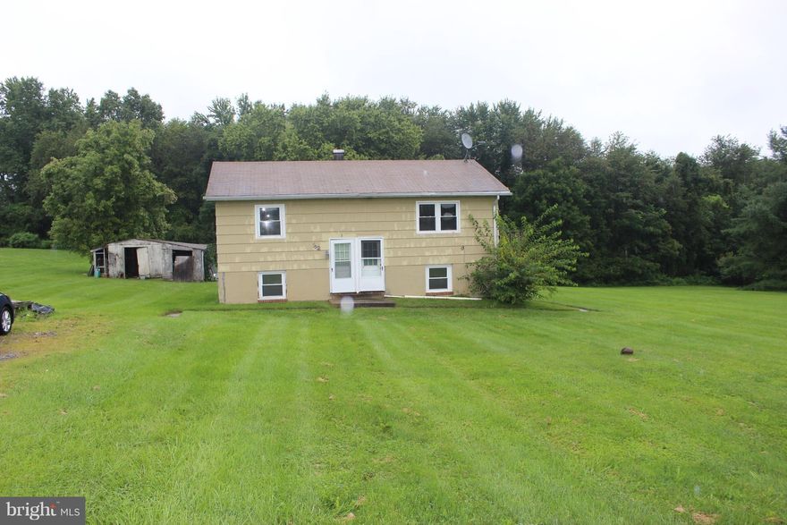 over 1 acre  country living.  house is  divided into 2,   2br 1 ba  units  live in one  rent the other  or  can be easily converted back to a single unit split foyer  rents in the area at 1200+  for  2br 1 ba