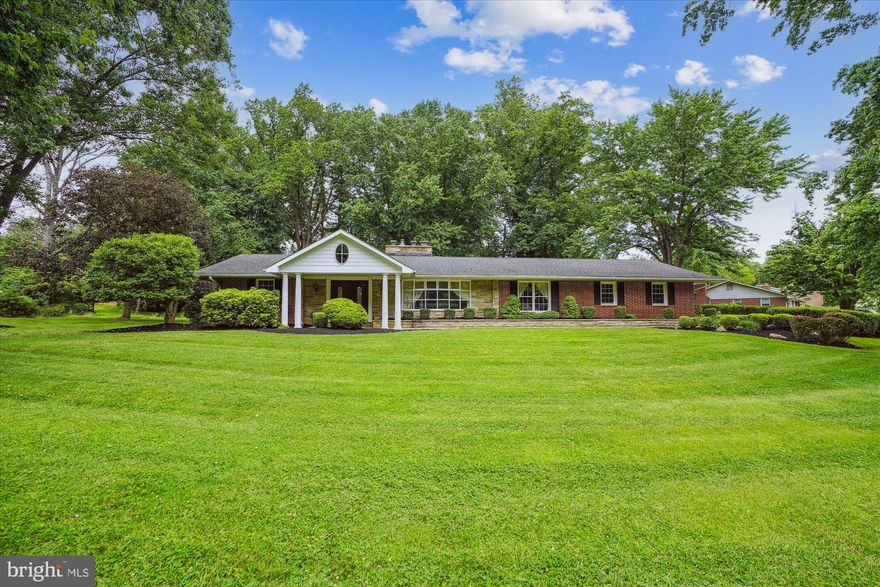 UNUSUALLY LARGE, WELL PLANNED FOUR BEDROOM, ONE-LEVEL, BRICK MID-CENTURY CLASSIC RANCHER WITH OVER 4,950 SQUARE FEET OF FINISHED LIVING AREA.  DOUBLE LOT AFFORDS AMAZING SPACE FOR YOUR DREAM YARD WITH A GARDEN, POOL, & HOT TUB. TRADITIONAL FLOORPLAN FOR ELEGANT ENTERTAINING & EFFICIENT DAILY LIVING.  THE PRIVATE MAIN LEVEL BEDROOM WING HAS FOUR SPACIOUS BEDROOMS, EACH WITH A WIDE CLOSET & WOOD FLOORS. THE QUIET PRIMARY SUITE HAS FOUR CLOSETS, A SITTING OR PERSONAL DRESSING RM, OFFICE OR NURSERY PLUS PATIO ACCESS.  THE BEDROOM WING HAS A FULL-SIZED LAUNDRY.  FORMAL & INFORMAL LIVING AREAS INCLUDE A LARGE LIVING & DINING ROOM, CUSTOM KITCHEN WITH STAINLESS & PULL-OUTS PLUS A DOUBLE FRENCH DOOR BEVERAGE FRIDGE & WET BAR.  OFF THE FULLY APPOINTED GRANITE KITCHEN IS A LARGE MUD ROOM WITH CONVENIENT REAR SERVICE DOOR EXIT TO GORGEOUS BACK YARD & CONVENIENT DRIVEWAY ACCESS. THE MUD ROOM ALSO OFFERS DOUBLE FROSTED GLASS DOOR PANTRIES, A COAT CLOSET & POWDER ROOM PLUS THE 2ND LAUNDRY (HOOK UP). THERE ARE 3 MASONRY FIREPLACES.  BEAUTIFUL LOT WITH SPACIOUS TILE PATIO & ORIGINAL STONE BBQ, STONE WALKWAYS, FRONT PORCH & RAISED FLOWER BEDS.    2ND FULL KITCHEN ROUGH-IN IN 2500 SQUARE FOOT LOWER LEVEL THAT INCLUDES A FIFTH BEDROOM, FULL BATH, OFFICE & LARGE RECREATION SPACE. THOUGHTFUL RENOVATIONS INCLUDE: ARCHITECTURAL ROOF, PORTICO, FLOORING, KITCHEN,  MECHANICALS, LIGHTING & MORE. NO HOA FEES. AMPLE PARKING.