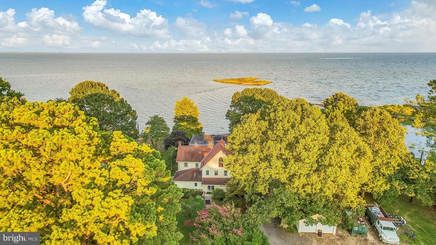 A true waterfront gem offers 6.54  acreage of flat land overlooking the Chesapeake Bay. This rare find offers almost 600 ft of water frontage, private sandy beach, panoramic breath taken views from every angle, and your very own private oasis.large flat land and field also offers so many options of use so make your appointment today to see this one of a kind waterfront. Home needs work - AS -IS