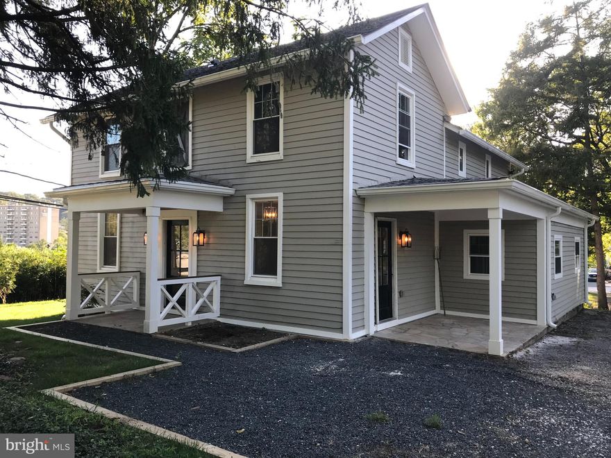 Amazing complete remodel of this 1850 Farm House (NOT in  the boundaries of "Historic Lutherville") with stunning trim details. WILL BE AVAIL TO SHOW SATURDAY MAY 23! Gorgeous Shaker Style Kitchen with All NEW Maytag Appliances! All NEW Electrical! All NEW Plumbing including NEW Water Main!  All NEW Sprayed-in Insulation that keeps the temperature stable in the house and easy on your utilities budget! All NEW Windows!  All NEW Gorgeous, Wide Plank, Oak Hardwood Floors! Recessed Lighting! Stone-floored Front and Side Porches! Incredible Views, Incredible Sunsets!  Previous  owner  had his Dentist's office out back which could be converted to a wood-working shop, huge garage, etc.  This particular property is Zoned DR3.5 which should allow for you to add a separate residence - perhaps an In-Law apartment, etc. without having the property re-zoned. The property is perfect for a tradesperson who would like to have a huge garage to park their work vehicles.  There is nothing on the market like this property... so much opportunity in this property's amazing location! Seller is listing agent and will meet you at the property to answer any questions you may have about the renovations.