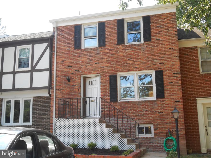 Three level house with hardwood flooring throughout home, split level living room, separate dining area, eat in kitchen, brick front, spacious.