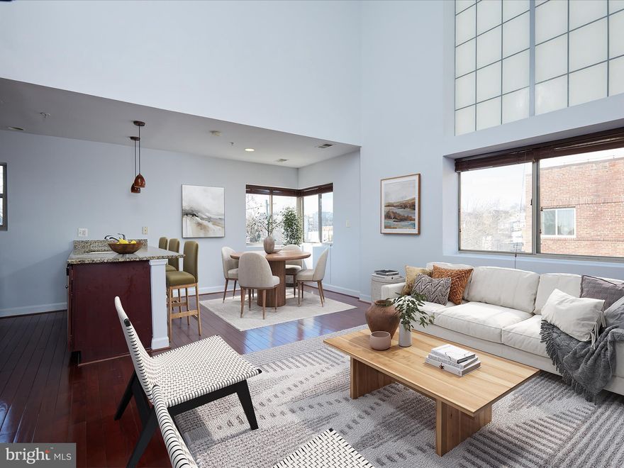 Top floor 2-level 2 bedroom and 2 bathroom Corner unit with loads of natural light at the Jefferson Condos. Open floor plan with a wall of windows and 20 ft. high ceilings on the main level.   Beautiful wood floors and exposed brick in the living area.  Updated kitchen with stainless steel appliances and granite counters. 2 bedrooms, one on the main and one on the upstairs level and 2 full baths one on each floor too.  The upstairs level which is awash in natural light has space for a separate office that leads to your own  private roof deck.   Newer washer and dryer (2024) in the unit.  New carpet just installed in the both bedrooms and just freshly painted too.  Pets friendly building

Close to Takoma Park redline metro, multiple bus lines, and such neighborhood restaurant favorites as Taqueria Distrito Federal, Moreland's Tavern, and Brightwood Pizza.   And nearby are grocery stores including Whole Foods and Safeway plus Takoma Park, Downtown DC, Silver Spring and Rock Creek Park trails.  Great news!. The Jefferson condo, which is professionally managed by EJF Real Estate,  just reduced the monthly condo fee in January 2025  from $709  to $585. Why rent  in DC, when you can buy an affordable 2 bedroom 2 bath.  Photos are virtually staged. A Must See!