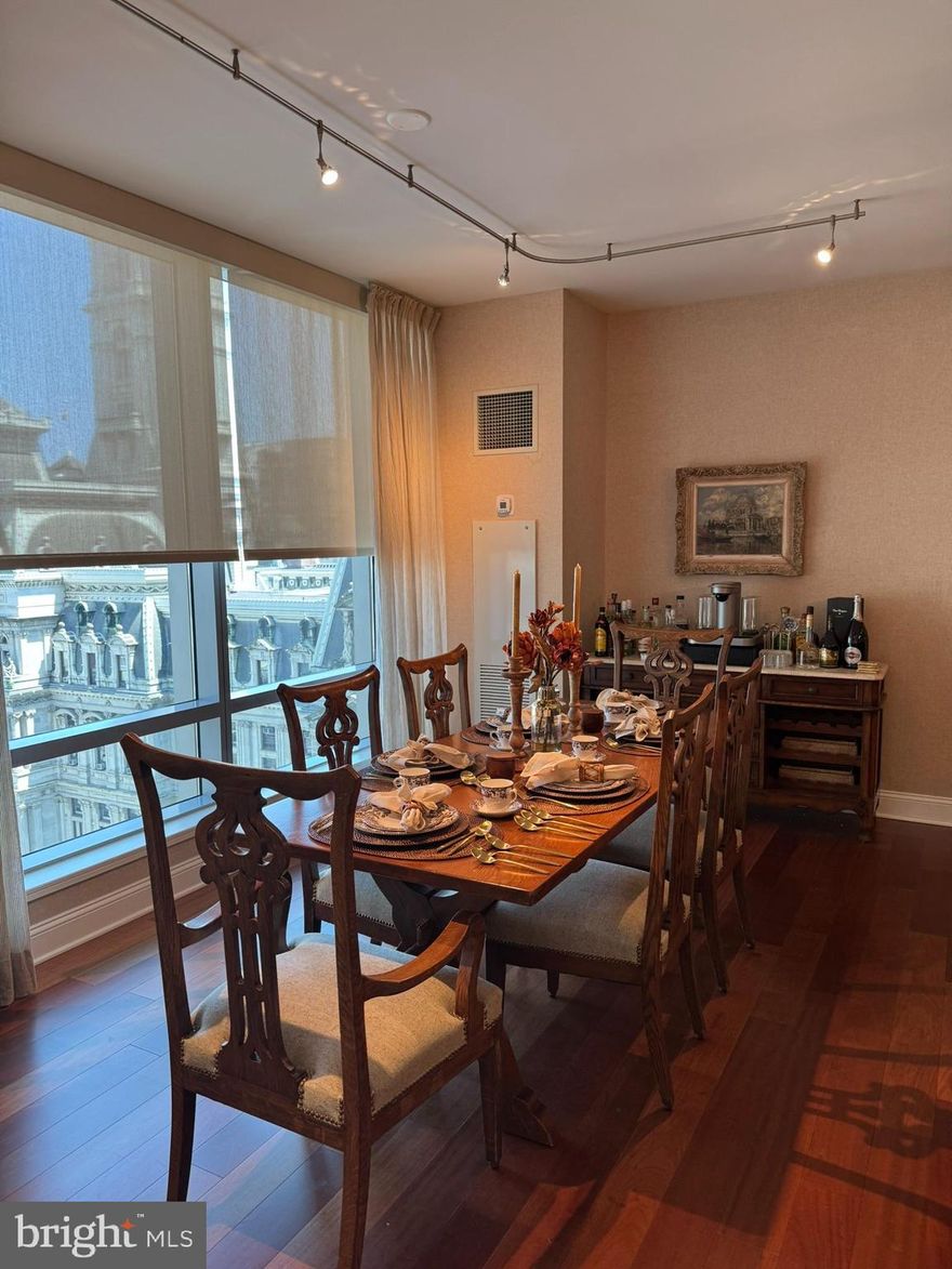 Highly desirable corner 2-bedroom, 2 1/2 bath layout with PARKING INCLUDED. Floor-to-Ceiling operable windows allowing natural light & perfect views of City Hall & Dilworth Park. 
Custom designed with wood floors throughout, a gas ventless fireplace with custom built-ins, a gourmet kitchen with Subzero refrigerator, Viking 5-burner cook-top, Viking wall oven and convection microwave, Miele dishwasher and Uline wine fridge. The main bedroom has two custom- fitted closets, one of which is a walk-in, and a luxurious ensuite bath. The second bedroom has a custom-fitted closet and an ensuite bath with Crema Marfil marble.
Residents enjoy amenities that include 24-hour concierge and valet parking, porters, doorman, chauffeur service, 7000 sq. ft. state-of-the-art fitness center, indoor 54’ lap pool, hot tub, locker rooms with showers, yoga/additional exercise room, resident lounge, theater room, on-site dog park, outdoor terrace with grills, dining areas, fire pits, and lounge seating, and a gated garden with direct access to The Ritz-Carlton Hotel.