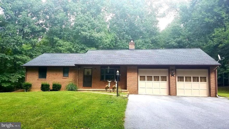 Lovingly maintained brick rancher surrounded by over 2 and a half acres of tree lined land just waiting for your finishing touches.  Bay window brings in lots of natural light, hardwood floors underneath the existing carpeting.  New roof in 2016. Over-sized attached 2 car garage with workshop plus additional 2 car garage, storage sheds and wood shed. Private and spacious setting with tons of potential. Cozy, quiet and move in ready!