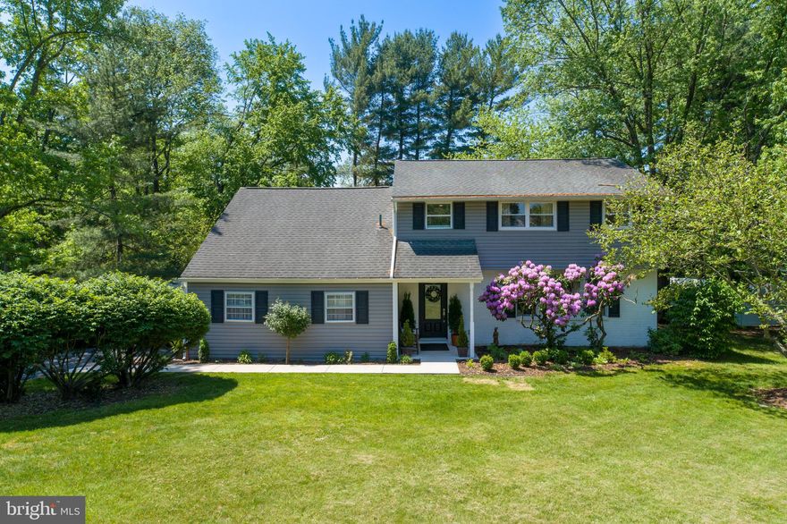 Set on a beautifully maintained half-acre lot, this stunning 4-bedroom, 2.5-bath home has been completely updated with today’s buyer in mind. A classic center hall entrance welcomes you into a bright and open floor plan designed for both everyday living and effortless entertaining. The gourmet kitchen is truly the heart of the home, featuring quartz countertops, stainless steel appliances, a premium Cosmo 6-burner gas range, built-in microwave, neutral tile backsplash, and an impressive 8-foot center island offering abundant prep space and seating. Luxury plank flooring flows seamlessly throughout the entire first floor, enhancing the home’s modern and cohesive feel. Just steps away, the inviting step-down family room offers warmth and character with a cozy wood-burning fireplace and sliding glass doors leading to a slate patio and fully fenced rear yard complete with a new shed—perfect for outdoor entertaining, play, or relaxing evenings at home. Additional highlights include a convenient main-floor laundry room with custom built-in cubbies, a large storage closet, direct access to the attached garage, and a three-zone HVAC system providing efficient comfort and temperature control throughout the home. Upstairs, you’ll find four spacious bedrooms and two beautifully updated full bathrooms. The primary suite serves as a luxurious private retreat, complete with a walk-in closet, ceiling fan, and a stunning en-suite bath featuring a walk-in shower with dramatic black-framed glass enclosure and marble tile surround for a true spa-like feel. A dual-sink vanity with white marble countertops, sleek matte black fixtures, and clean-lined cabinetry provides both elegance and generous storage. Nature lovers will appreciate direct neighborhood access to township open space with scenic wooded walking trails, creating a peaceful extension of this already exceptional property. Ideally located in the award-winning North Penn School District and just minutes from Trader Joe’s, Whole Foods Market, Wegmans, Giant, parks, shopping, and dining. Commuters will enjoy convenient access to regional rail lines as well as Routes 309, 202, 73, and the Pennsylvania Turnpike, making travel to Center City Philadelphia and surrounding areas simple and efficient.