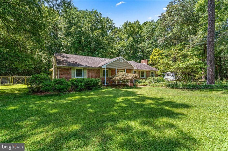 Looking for a private setting with room to spread out and enjoy nature? This 2427 sq ft, 3 bedroom, 2.5 bath rancher nestled on 4.40 acres may be just the place to call home! The property includes 2 outbuildings (24 x 36 and 24 x 24). Both are currently used as art studios but could be workshops or converted into garages. The home has hardwood and tile flooring throughout, replaced windows, a masonry fireplace and a functional floor plan that includes a 24 x 25 great room, eat-in kitchen w/ pantry, an office w/ French door entrance, a primary bedroom w/ vaulted ceiling, private bath w/ steam shower, walk-in closet and a flex space leading to it, 2 additional bedrooms, a hall bath, a utility room and a powder room. The back yard, that can be accessed from the great room, utility room and the primary bedroom, is fenced and features a deck for relaxing in the sunshine and a swing set for the little ones.