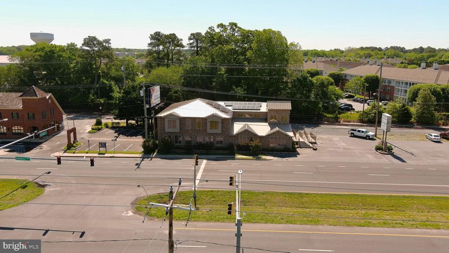Class A office/professional center on Lighted Intersection of Rt13 BUS and Pine Bluff Rd in Salisbury.  Within walking distance from Salisbury University and student housing.  This 8,000sqft+/- building sits on over a half an acre right on the highway with plenty of parking. There are 10+ examination rooms, specialized mechanical and electrical infrastructure for medical equipment. Utilize the solar panels, backup generator, half basement for mechanicals complete with sump pump, this building is ready for your business and/or would make a great investment.  This location will hold its value for many years to come.