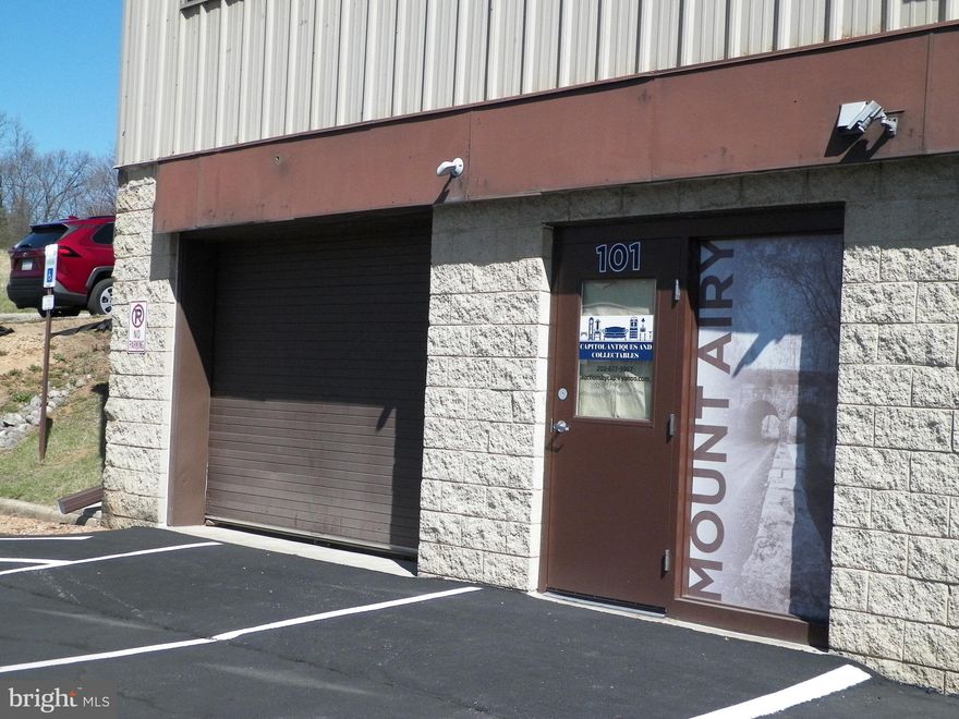 Commercial space for sale on Center Street in Mount Airy MD.  Unit 1 is 1,214 sf and features a 10' x 8' Overhead  Door with Glassdoor Entry Way, Ceramic Tiling, Exposed Ceiling Venting, Open Space with a Modern Bathroom.  Currently tenant occupied as office/warehouse space.  Property is conveniently located within the Town of Mount Airy with easy commuter access Routes 27 & 26 and I-70.  Unit is available for owner occupants or investors.