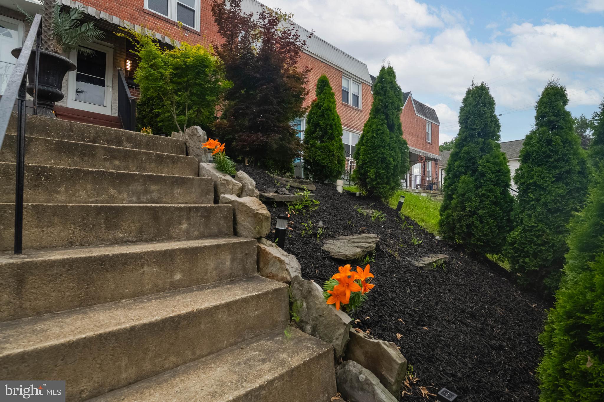 Curb appeal that shines all day long! This move-in ready home features a beautifully updated kitchen with granite countertops and custom lighting, plus a stylishly renovated full bath with designer tile and a skylight. The versatile basement offers a bedroom or clubroom, laundry area, and rear exit. Enjoy peace of mind with thermal windows, interior and exterior doors, and a roof coated and sealed recently. Outdoor living is a breeze with a covered front porch, rear patio, fenced yard, and private rear parking pad. Sold As-Is