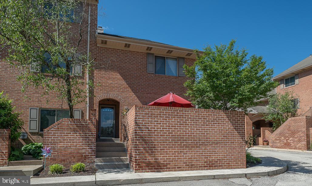 RARELY AVAILABLE END-UNIT AT HIGHLY DESIRABLE CRICKET SQUARE COMMUNITY! Welcome to this beautifully updated and spacious 3-bedroom, 2.5 Bathroom end-unit townhouse. Perfectly situated in walkable Ardmore, this home offers comfort, style, and unbeatable convenience — all within the award-winning Lower Merion School District. Step inside to a welcoming foyer with a chic updated powder room. The stunning renovated (2024) kitchen boasts granite countertops, stainless steel appliances, a marble backsplash, and a sunny eat-in breakfast area with sliding glass doors that open to a peaceful private patio — ideal for morning coffee or al fresco dining. The open-concept living and dining area features beautiful hardwood floors, a cozy wood-burning fireplace, and another set of sliding glass doors leading to a spacious second patio, perfect for entertaining or relaxing in the sunshine. Upstairs, the primary bedroom suite offers two closets and a full ensuite bath with both a tub and a separate shower. The second bedroom is equally generous, featuring two walk-in closets and easy access to a full hall bath and a convenient laundry area. The third-floor loft-style bedroom/office is a versatile space with skylights and two large closets — ideal for a guest suite, studio, or work-from-home retreat. Additional highlights include One assigned parking spot, ample guest/second car parking, a Separate locked storage area, and a meticulously maintained community. Walk-to-everything location — just steps to the train, Suburban Square, shops, and dining. Don’t miss this rare opportunity to own a beautifully upgraded home in one of the Main Line’s most vibrant neighborhoods!