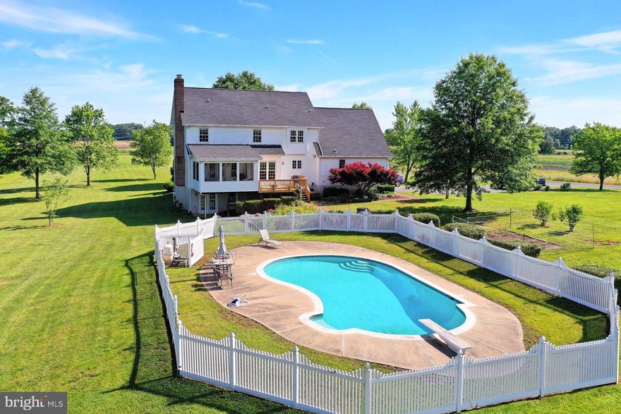Ten (10) Acres of bucolic living with 8' deep in-ground swimming pool and diving board for summer enjoyment and this 5 Bedroom, 3.5 Bath Custom Colonial with dental moldings, solid doors and shadow boxing enjoys a driveable distance to shopping, Routes 28, 29, I-66, Gainesville, and Manassas. Custom built for the original owner has provided the owners a wonderful home to be enjoyed inside and out.  Eat in kitchen with door access to side deck for easy access to your grill.  Blue Pearl Granite counter tops and full height back splashes.  5 Burner gas range and electric stove, Stainless Steel appliances and double kitchen sink.  Plenty of kitchen cabinets and a custom pantry cabinet.  Large Laundry ROOM off kitchen with great storage cabinets.  Light filled Gathering Room with Gas Fireplace and built in shelving with doors to screened sun room.  Composite decking with bead board and ceiling fan.   Huge attic space with windows above garage could be turned into a future office.   Updated Owners Bath with frameless shower, separate dual sinks, soaking tub and private water closet.   Establish an equestrian business, bring your work trucks, etc. Unlimited potential for this beautiful property.  Come home to quiet after working and enjoy the evening western and southern breezes all on your screened porch watching your dinner cook on your composite deck.  Lovely garden landscaping to appreciate.  Watch your guests enjoy the 8 foot deep pool surrounded by fencing and heated by the sun and soak in some natural Vitamin D.   Pool table and two (2) freezers convey!  Large garage with epoxy finished floor.  Tractor for potential sale.  Very short rent back might be needed.