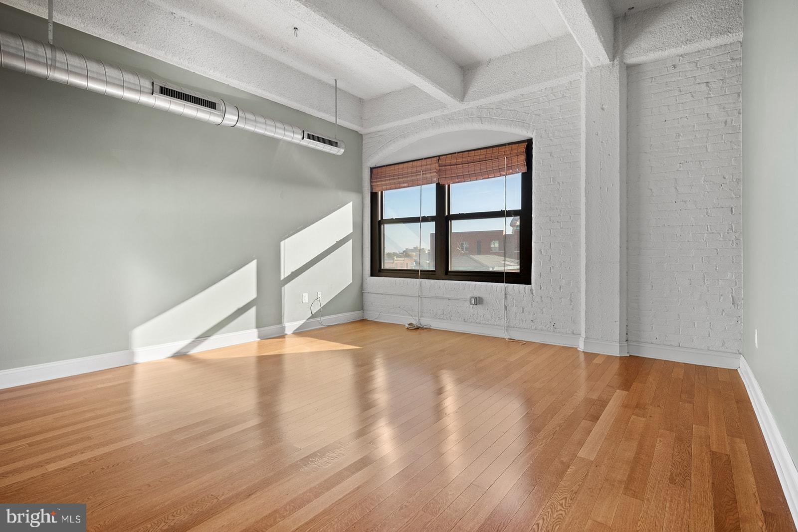 Fantastic Renovated Studio in the unique Marine Club Condominiums INCLUDING 1 DEEDED PARKING SPACE in the ATTACHED GARAGE, #212P! This unit has maple Hardwood Flooring, High Ceilings and features a welcoming hallway. On the right is a large Bathroom containing a Granite Vanity, Ceramic Tile Shower Enclosed with Glass and a NEWER WASHER AND DRYER (2025)! The left side of the hall contains several sizable closets, including some built-in storage. The hallway leads to the impressive OPEN KITCHEN featuring Frigidaire Stainless Steel Appliances, Granite Counters, Cherry Cabinetry, a LARGE ISLAND and a garbage disposal. The kitchen is open to the attractive, well sized main room, with BIG WINDOWS Facing South. Enjoy seeing the Walt Whitman Bridge and Broad St to your left, while being set back from Broad St such that it is quiet. Enjoy Sunshine for the majority of the day. The Condo Fee Includes the use of Great BUILDING AMENITIES: a 24/7 Concierge, Big Recently Renovated Fitness Center and Serene Outdoor Private Courtyard. Plus, the Condo Fee Includes water and trash utilities. The Courtyard features Beautiful Koi Fish Ponds, tables and chairs (regular and lounge). The building is PET FRIENDLY and has a pet exercise area in the Courtyard! The Marine Club is conveniently located on the southwest corner of S Broad St and Washington Ave, just yards from a Broad St line subway station entrance. Just across the street are Sprouts Farmers Market, CVS, Target, Chase Bank, a Wine and Spirits Store, Starbucks, PetSmart and Insomnia Cookies! Live just a few minutes from Center City while also being close to the restaurants, shops and bars of Graduate Hospital, Bella Vista, the Italian Market and Newbold.