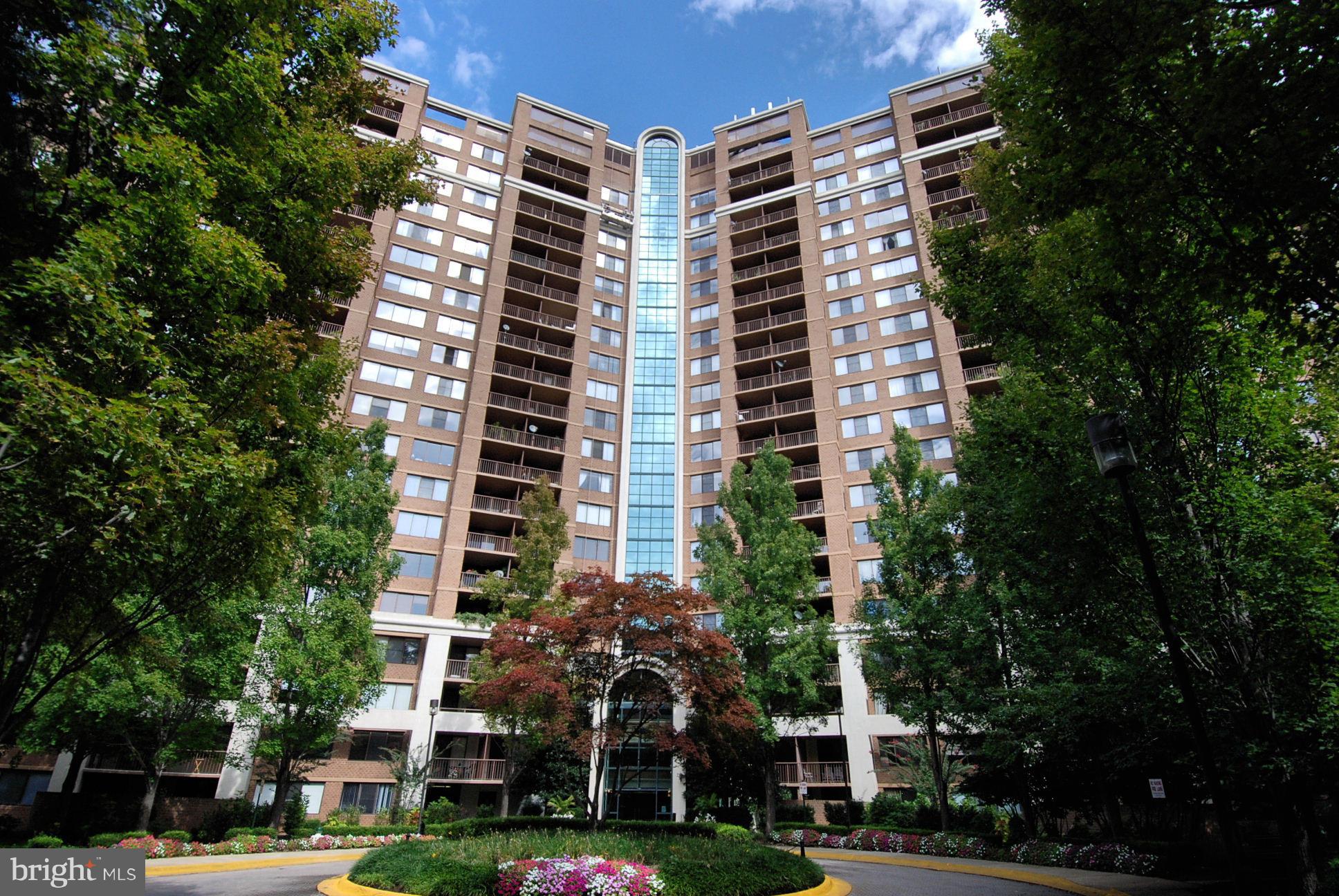 Rarely avail. 2 bd/2 ba Edwards Model. Sunlit corner unit feat.1200 sqft, open LR/DR, well-equipped kitchen w/granite & SS. Gorgeous new walnut floors, new windows, carpet, stove, fresh paint! W/D in unit, large balcony! Covered garage parking! Pool, tennis, gym, sauna, dog park, water incl. Easy walk to Grosvenor Metro; close to NIH, Walter Reed, 495. Pets OK! No assessments. 2nd space for $25k.