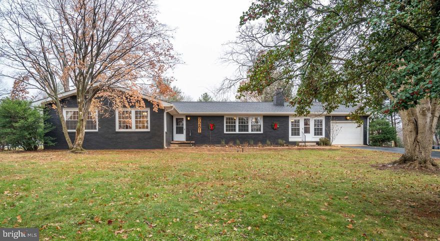Open house cancelled, home is active under contract.    Welcome to 7281 Mosby Drive featuring  four generous sized bedrooms and 2 full bathrooms all on the main level of this wonderful mid-century modern style home in Warrenton Lakes!  Hardwood flooring flows throughout the main level.  Fantastic gourmet kitchen featuring unique built in quartz bar seating for six.  42" white cabinets, stainless steel appliances, wood look ceramic flooring, and granite countertops!  Style extends into the living and dining rooms.  Arched entryways,  brick faux fireplace on the feature wall of built-ins in the living room, and  separate dining room entry to a lovely 3 season breezeway/patio room are some of the wonderful living areas on the main level.  From the kitchen you can exit to the large back deck that is perfect for entertaining.  The freshly painted, finished lower level has a family room with recessed lighting and new carpeting.  There is also a spacious rec room that can be used as a guest room and another room that would make a great office! Also on this level is the laundry room with wash sink and another huge storage room that leads out up the stairs to the rear yard.  Spacious 1 car garage with room for storage.  Long driveway for ample parking.  Lovely all brick home on the DC side of Warrenton for easy commuting.  Make your appointment today to see this wonderful home!